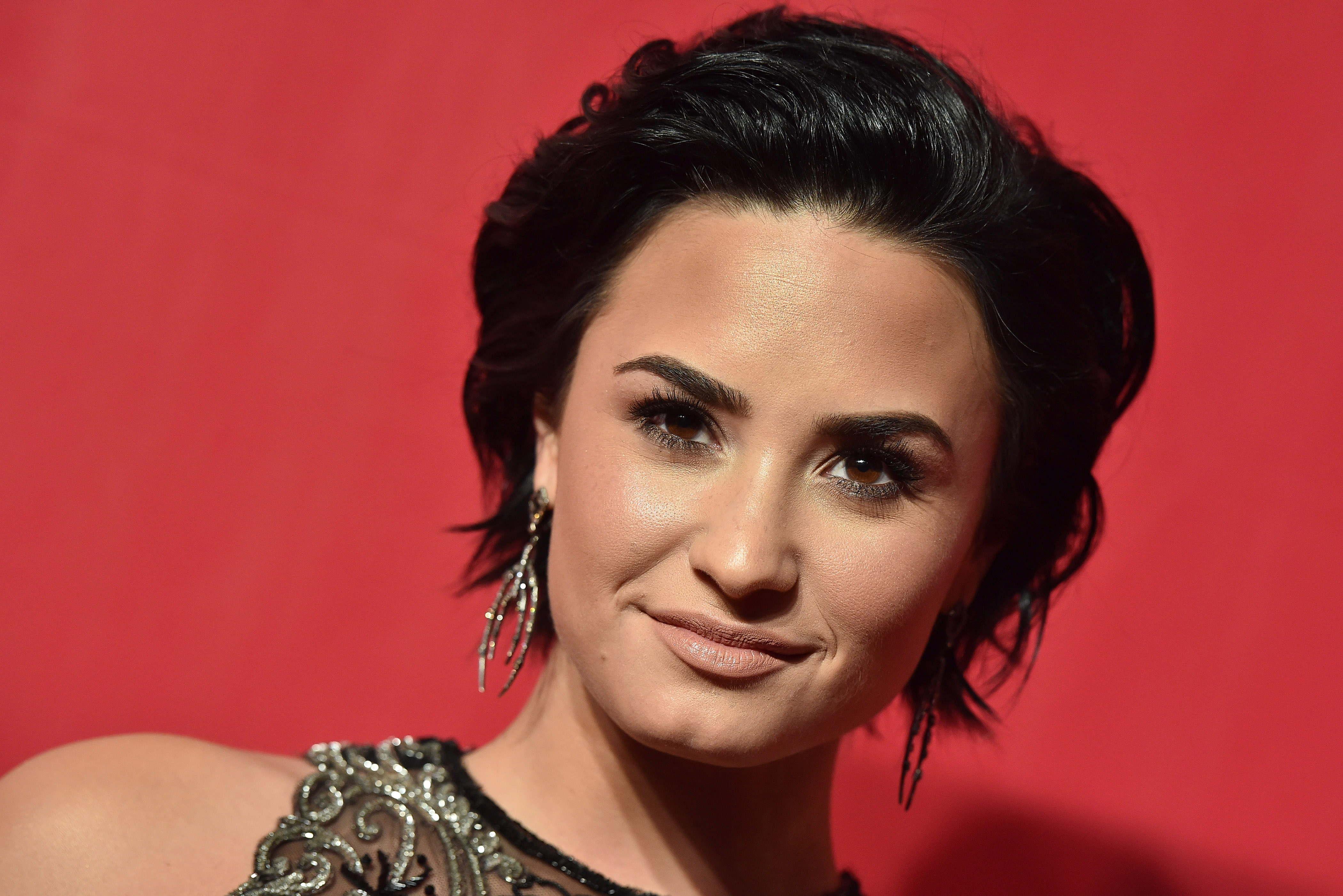 Singer Demi Lovato arrives at the 2016 MusiCares Person of the Year honoring Lionel Richie at Los Angeles Convention Center on February 13, 2016 in Los Angeles, California