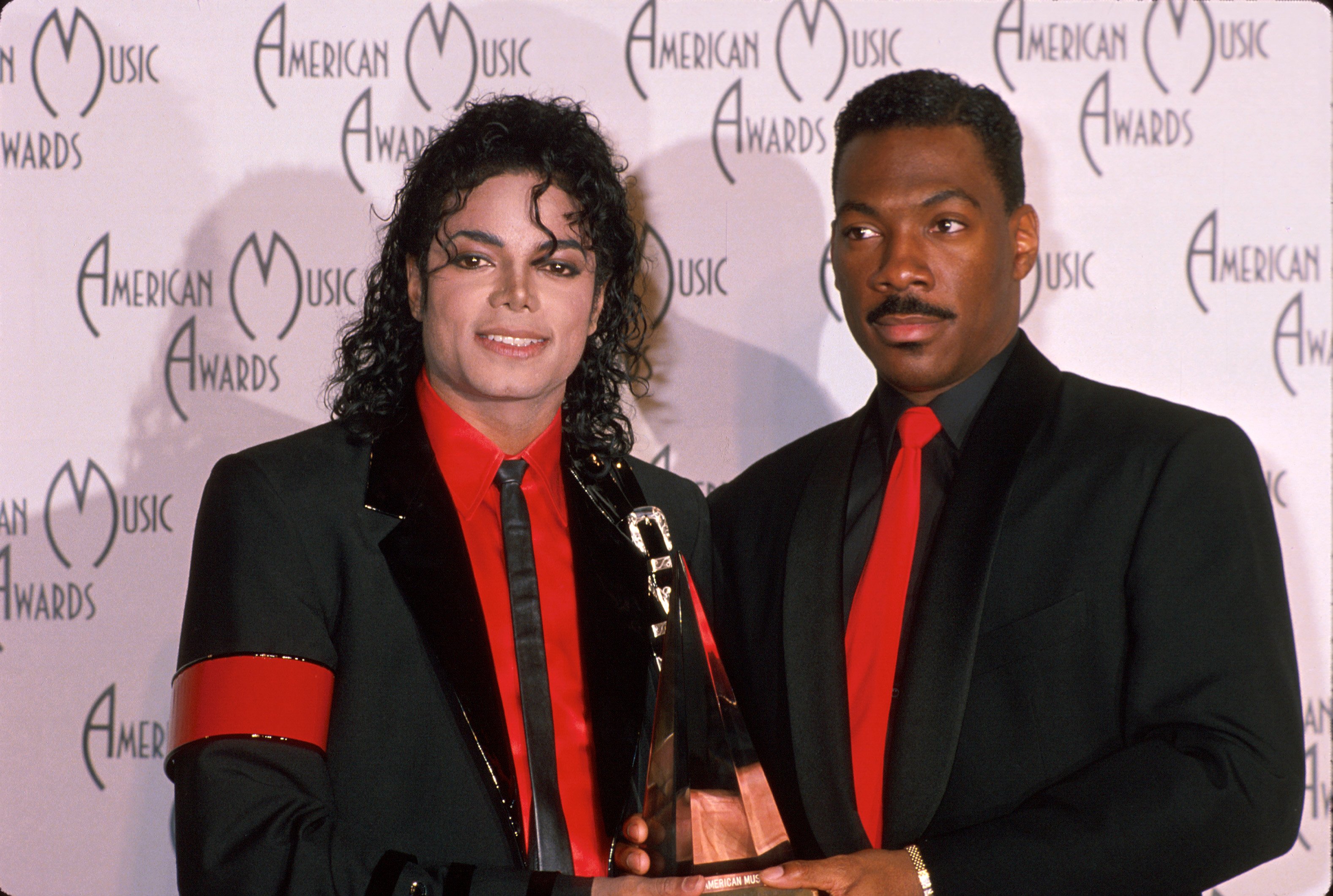 Michael Jackson and Eddie Murphy with an award