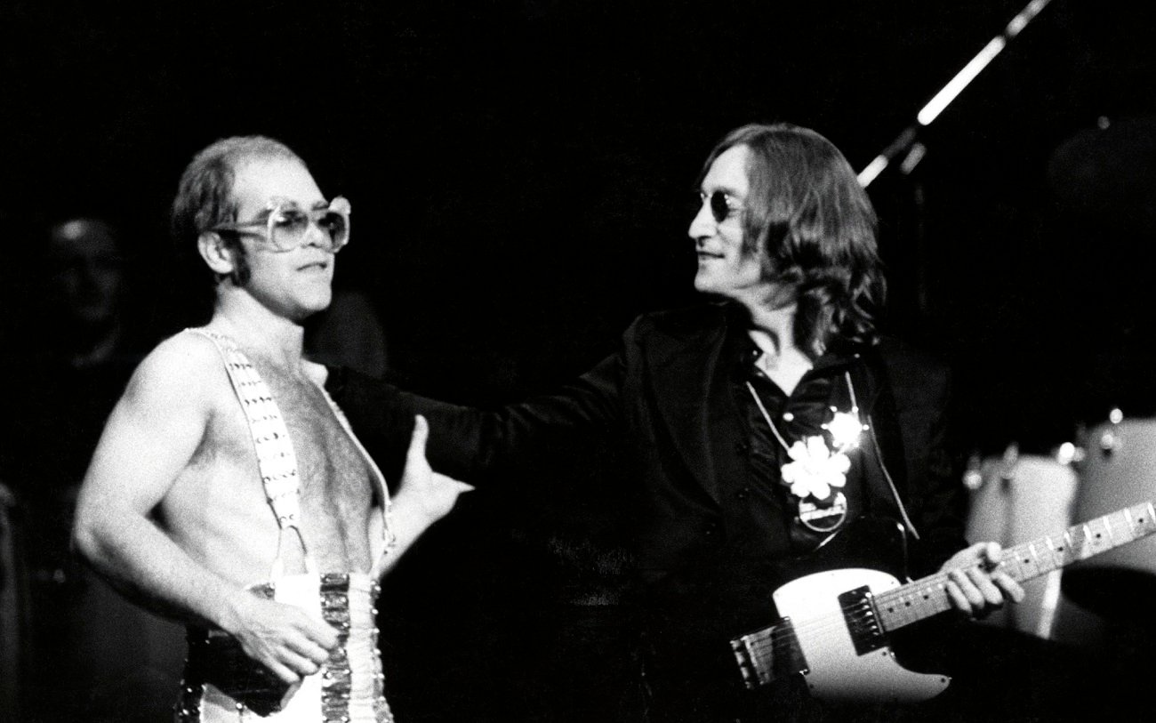 Elton john and John Lennon on stage