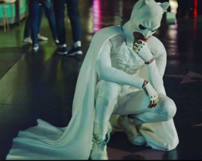 Jaden Smith kneeling in a white Batman suit 