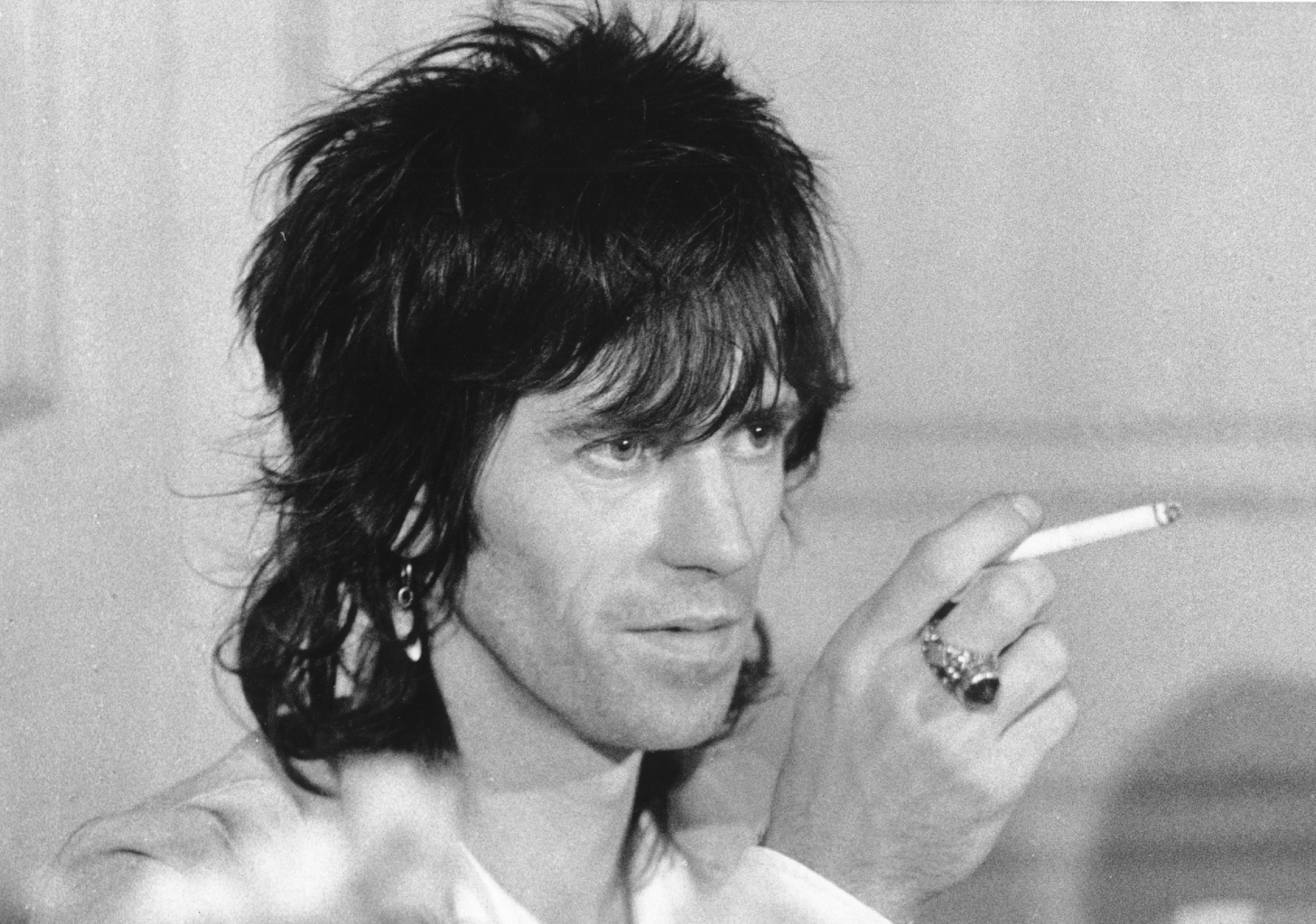 Keith Richards holding a cigarette