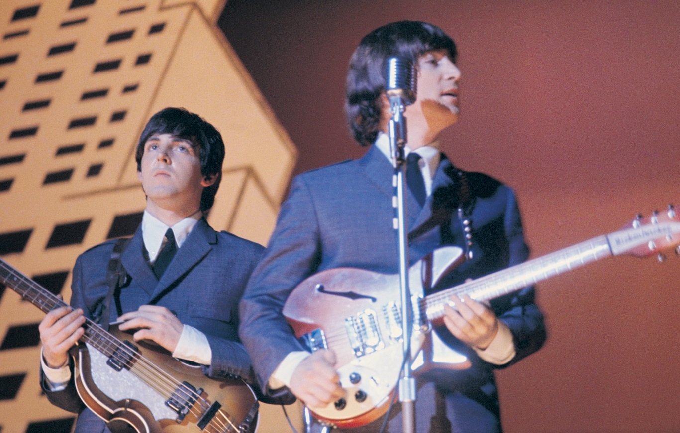 Paul McCartney and John Lennon on stage in 1965