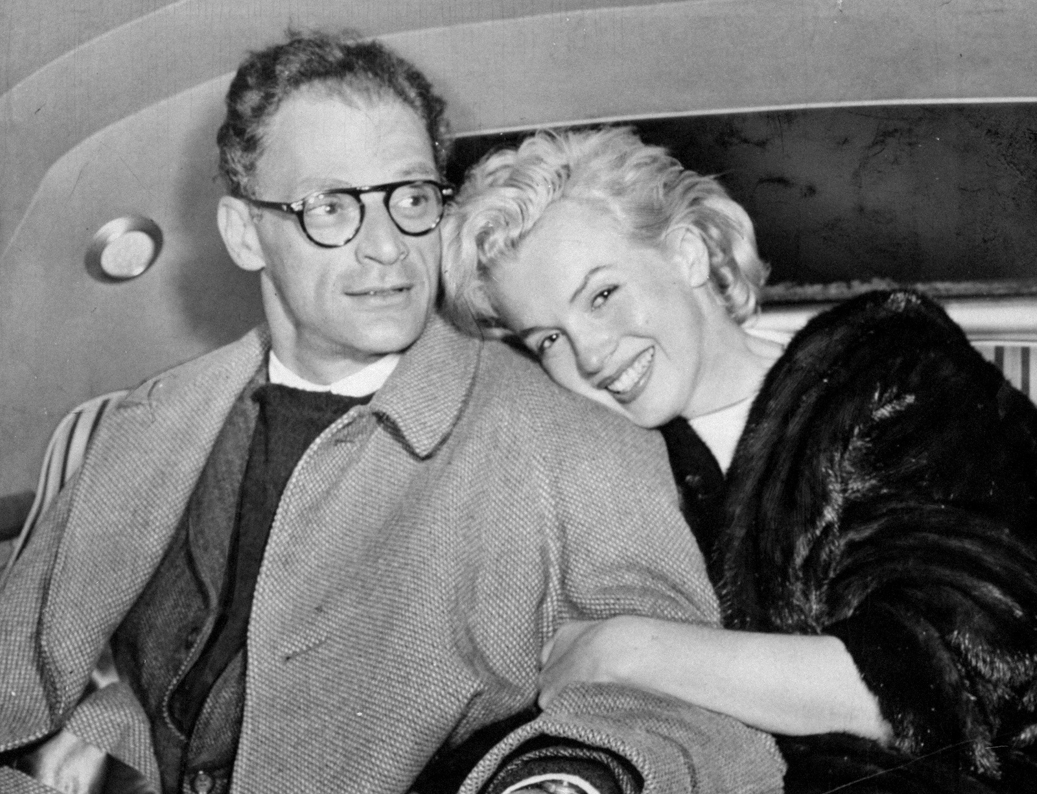 Marilyn Monroe and husband Arthur Miller in car at Idlewild