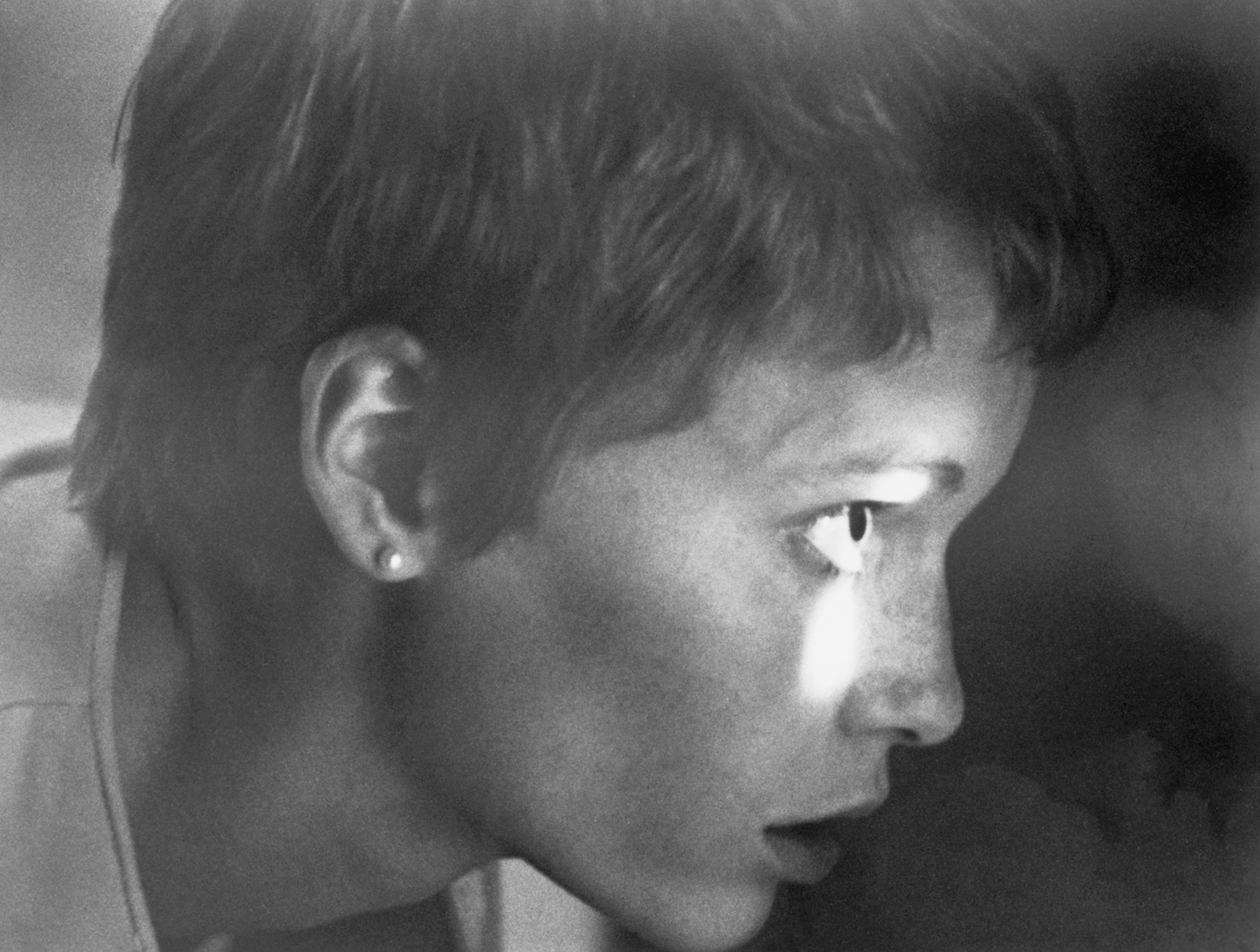 Mia Farrow looking through hole in Rosemary's Baby