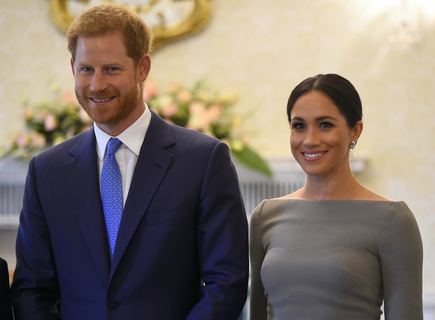 Prince Harry and Meghan Markle smile as they arrive to meet Ireland's President, Michael Higgins