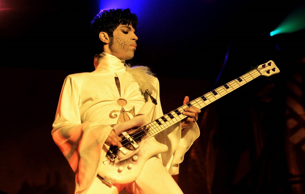 Prince playing bass guitar