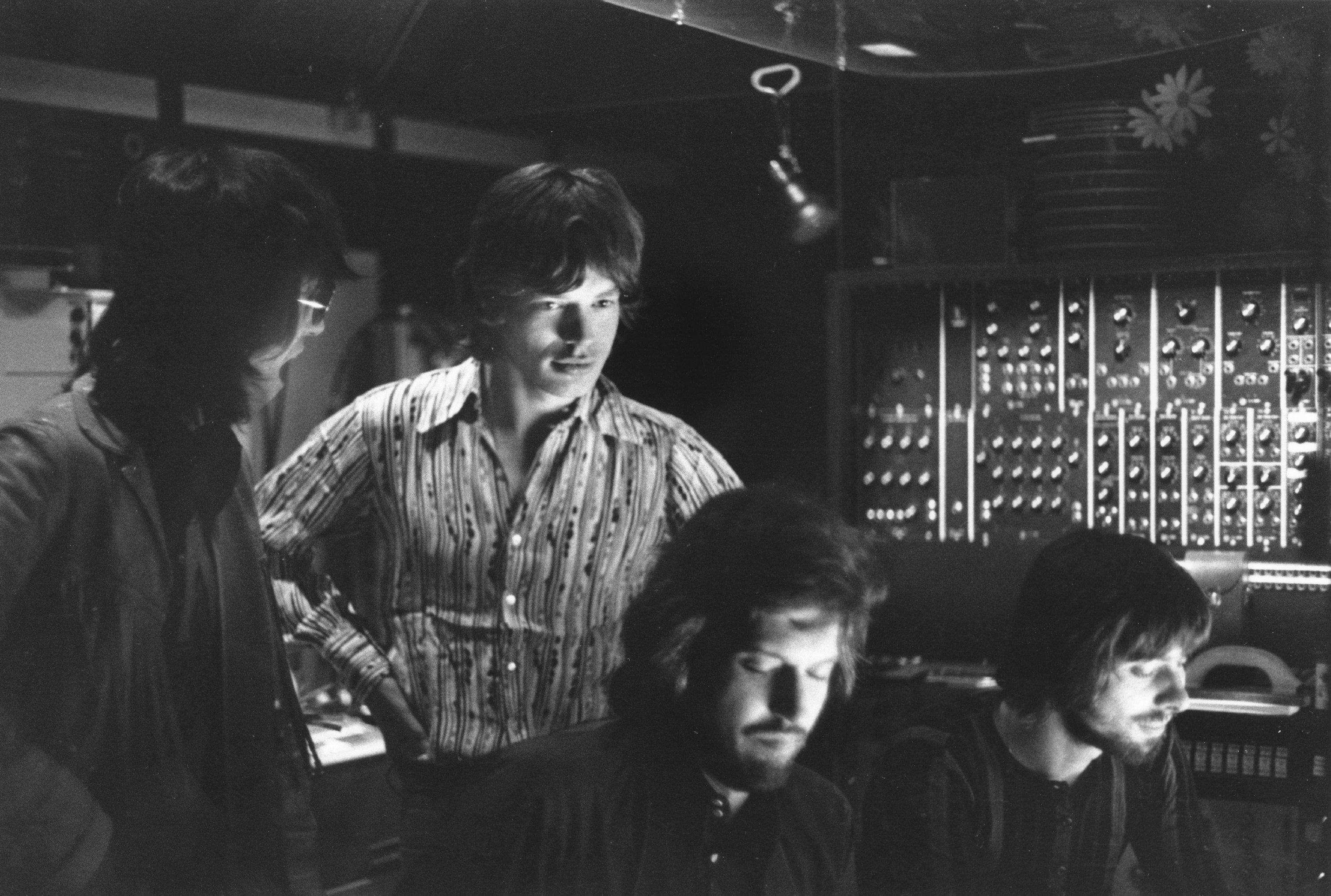 Mick Jagger and other members of The Rolling Stones near studio equipment