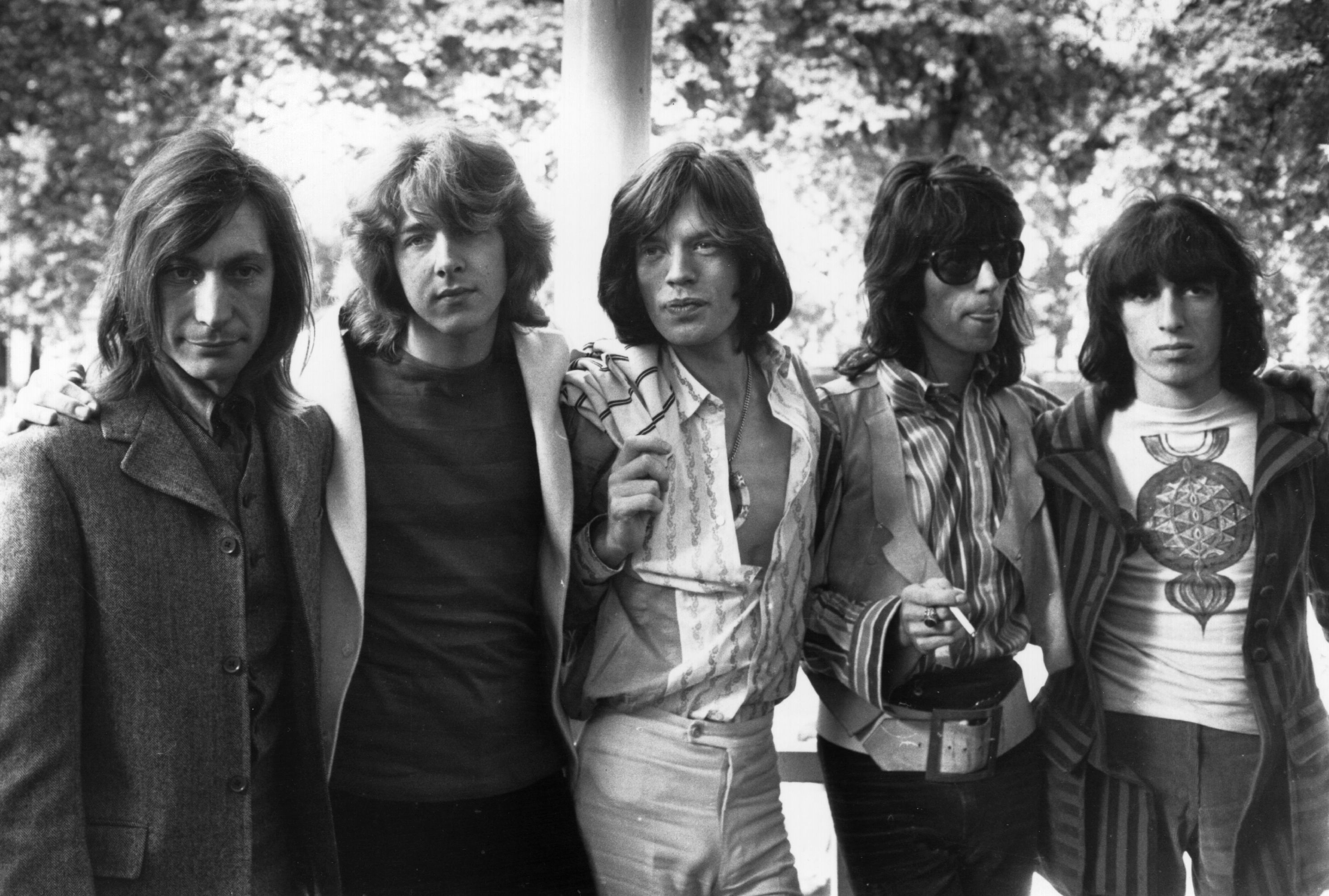 The Rolling Stones standing in a row