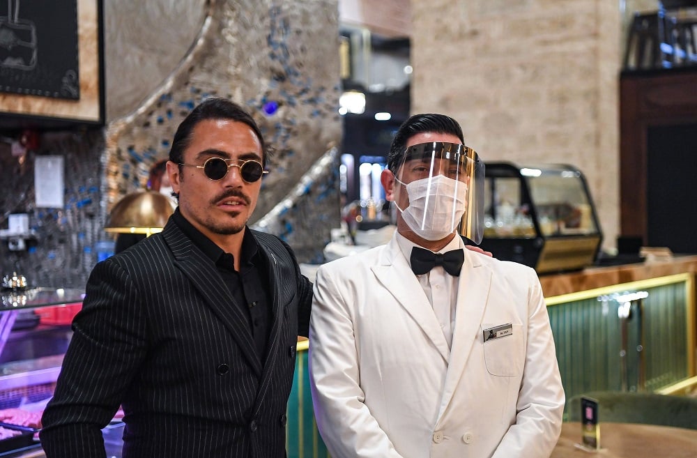 Nusret Gökçe (L), who fans call Salt Bae