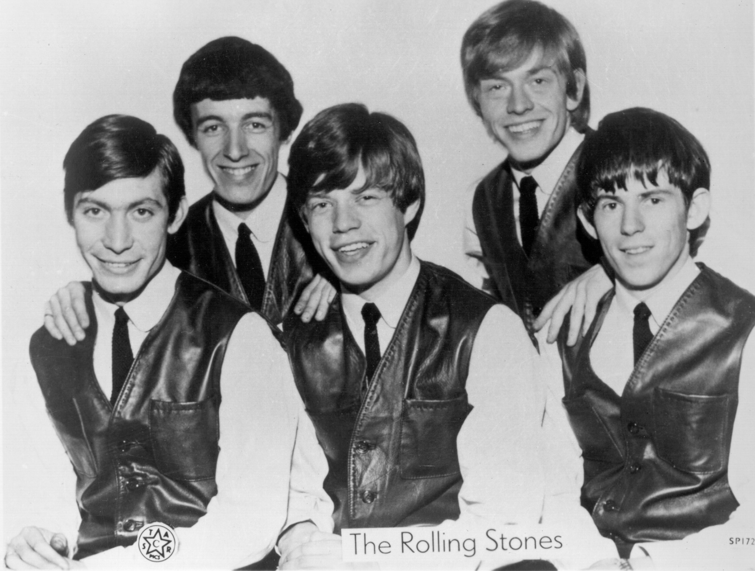 The Rolling Stones in front of a white background