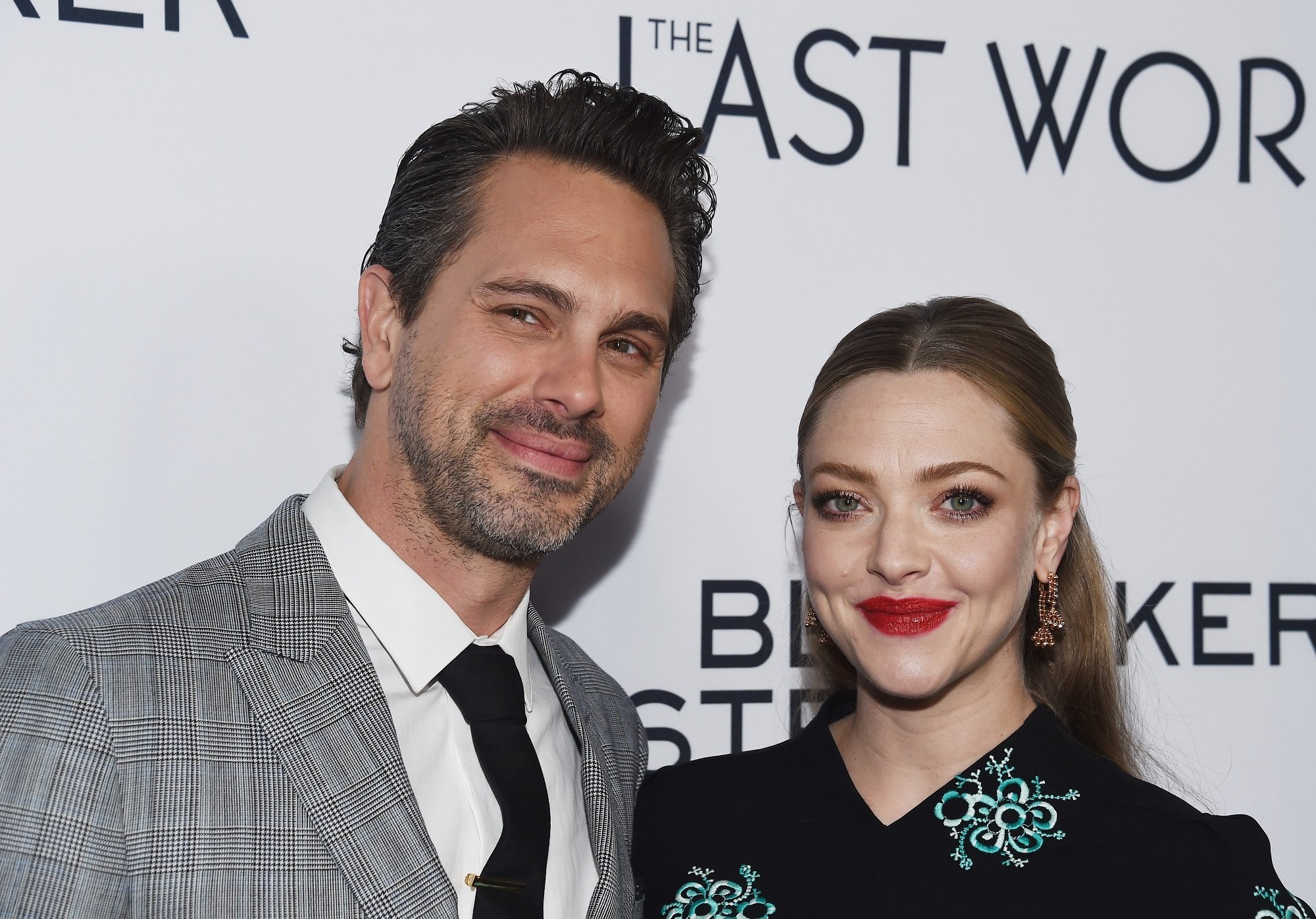 Thomas Sadoski (L) and Amanda Seyfried arrive at the premiere of Bleecker Street Media's 'The Last Word' on March 1, 2017 in Hollywood, California.