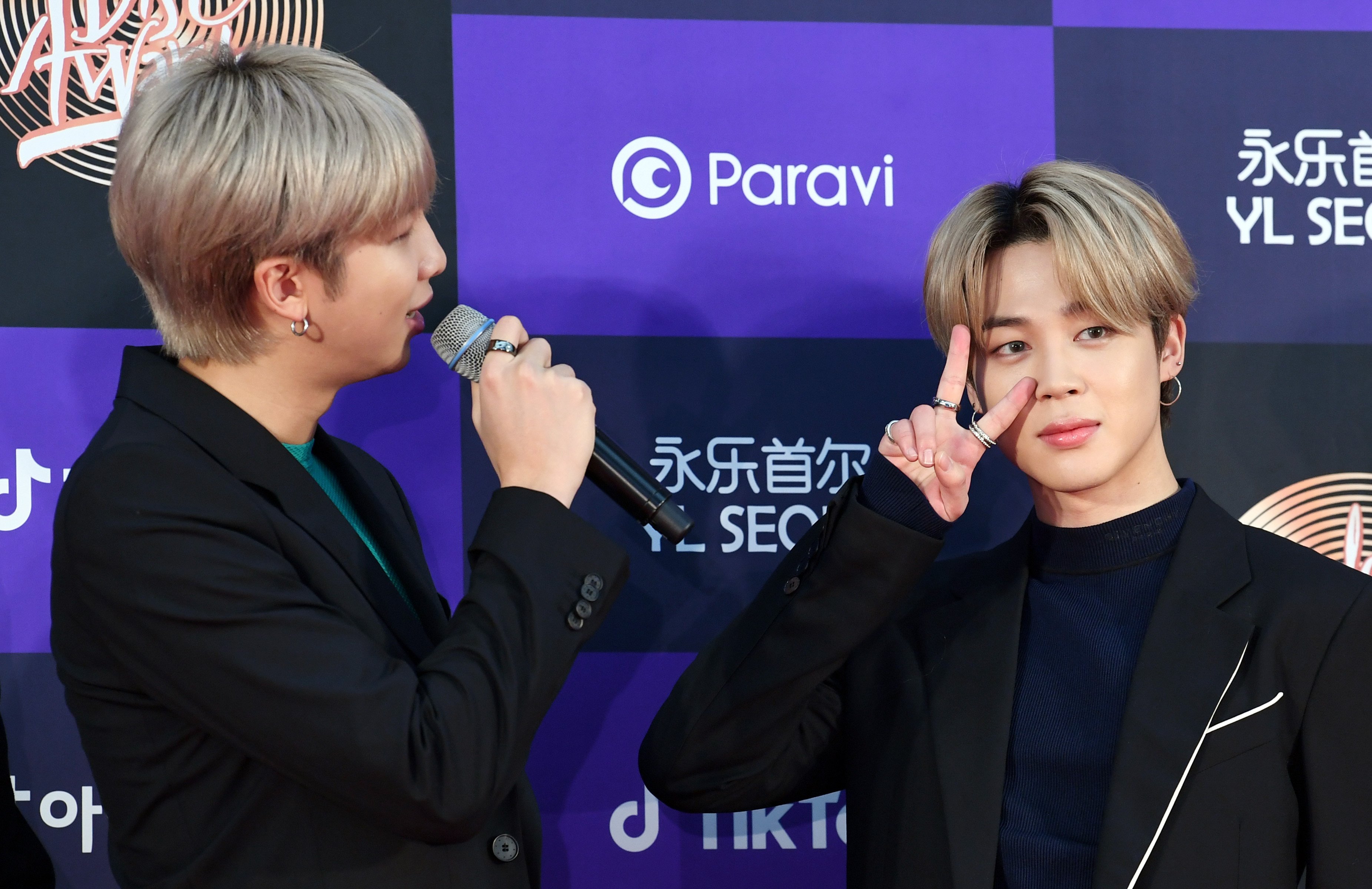 RM and Jimin of BTS arrive at the photo call for the 34th Golden Disc Awards