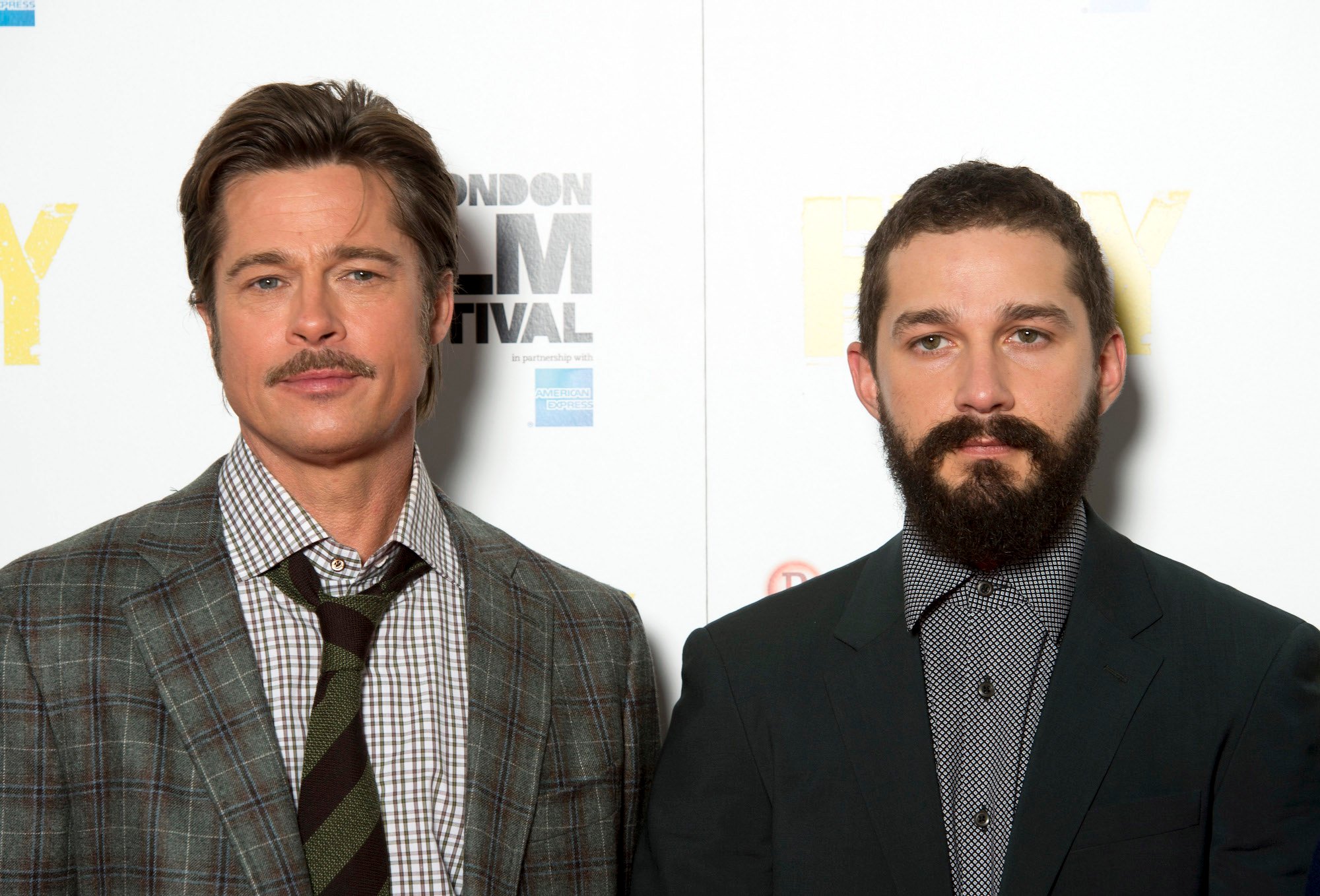 (L-R) Brad Pitt and Shia LaBeouf in front of a white background