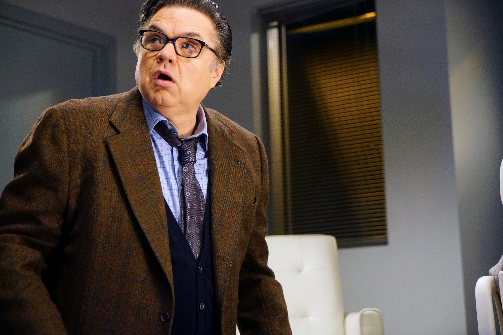 Oliver Platt as Dr. Daniel Charles looking up and to the left