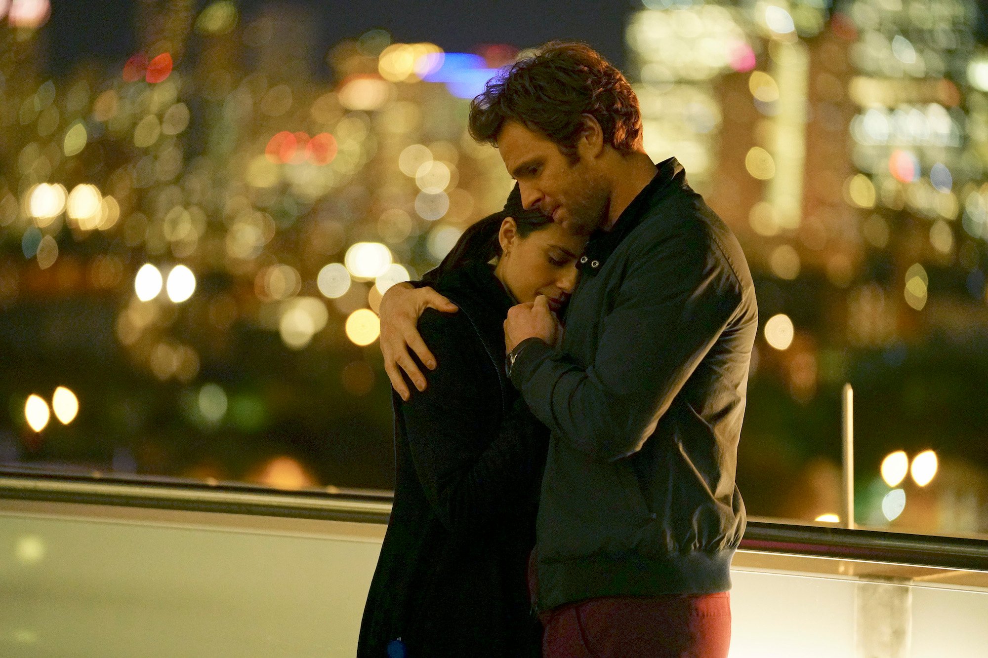 (L-R) Torrey DeVitto as Dr. Natalie Manning, Nick Gehlfuss as Dr. Will Halstead embracing