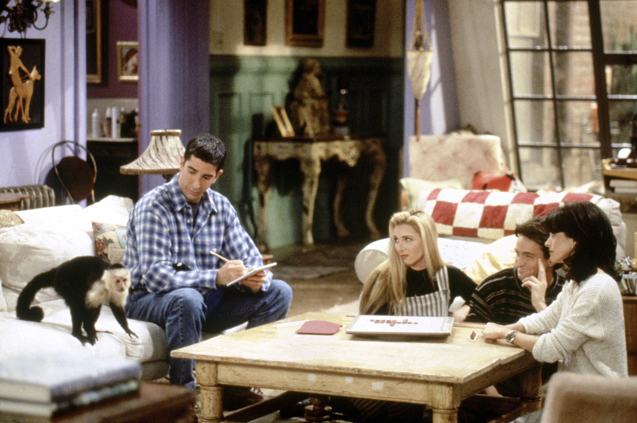 Marcel, David Schwimmer as Ross Geller, Lisa Kudrow as Phoebe Buffay, Matthew Perry as Chandler Bing and Courteney Cox as Monica Geller in Monica and Rachel's apartment
