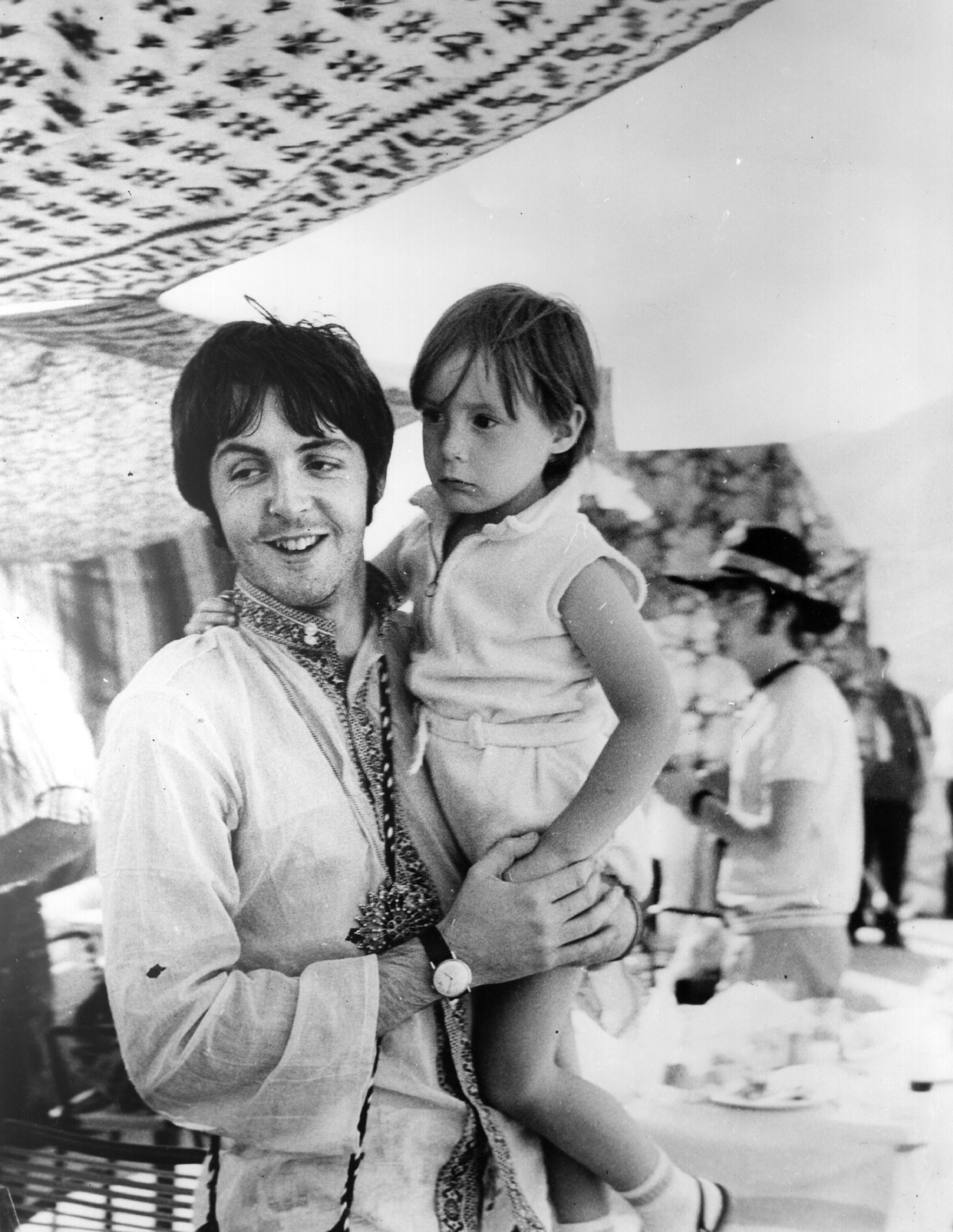 Paul McCartney with a 4-year-old Julian Lennon in Greece