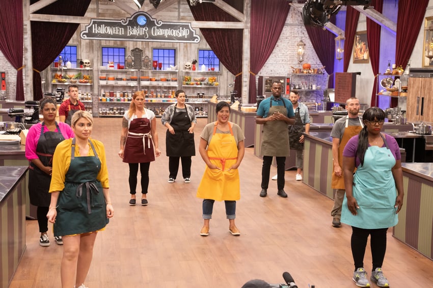 Contestants on Halloween Baking Championship socially distanced from each oth