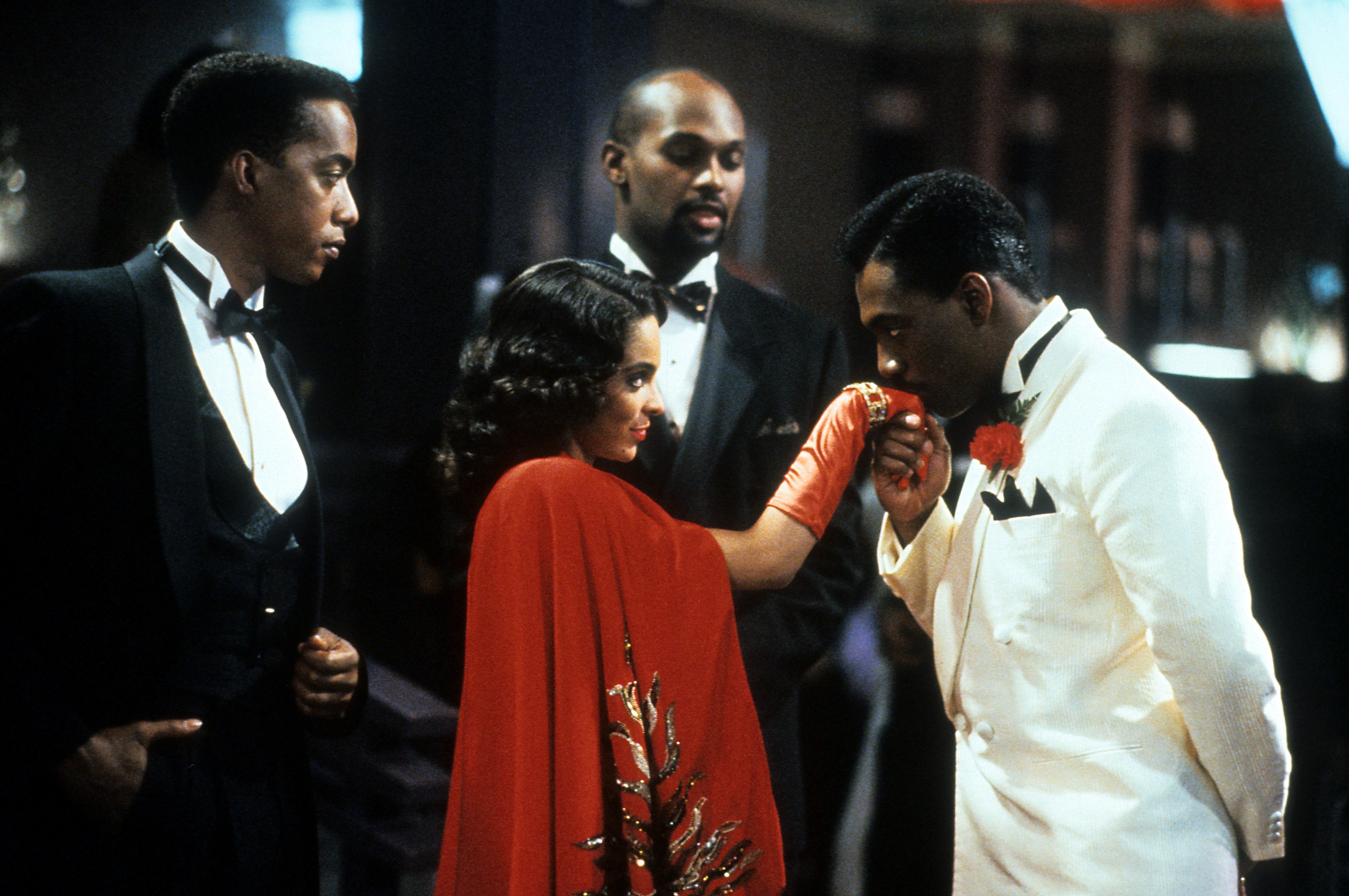 Jasmine Guy has her hand kissed by Eddie Murphy in 'Harlem Nights'