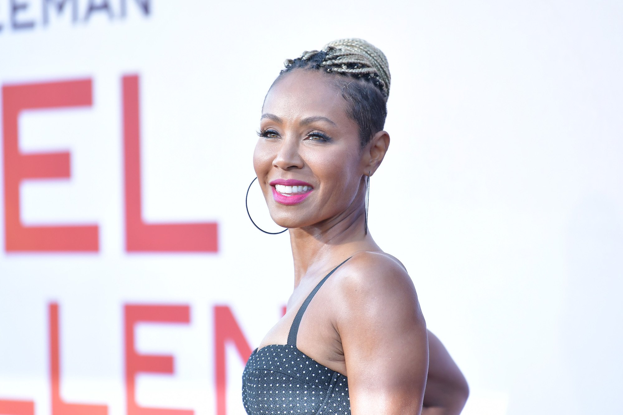 Jada Pinkett Smith smiling, turned to the right