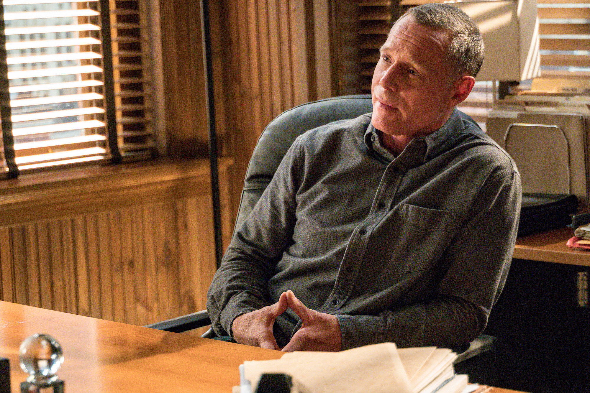 Jason Beghe as Sgt. Hank Voight on 'Chicago P.D.' sitting at a desk