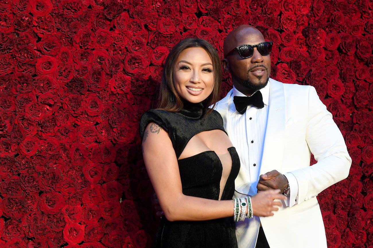 Jeannie Mai and Jeezy posing together, holding hands