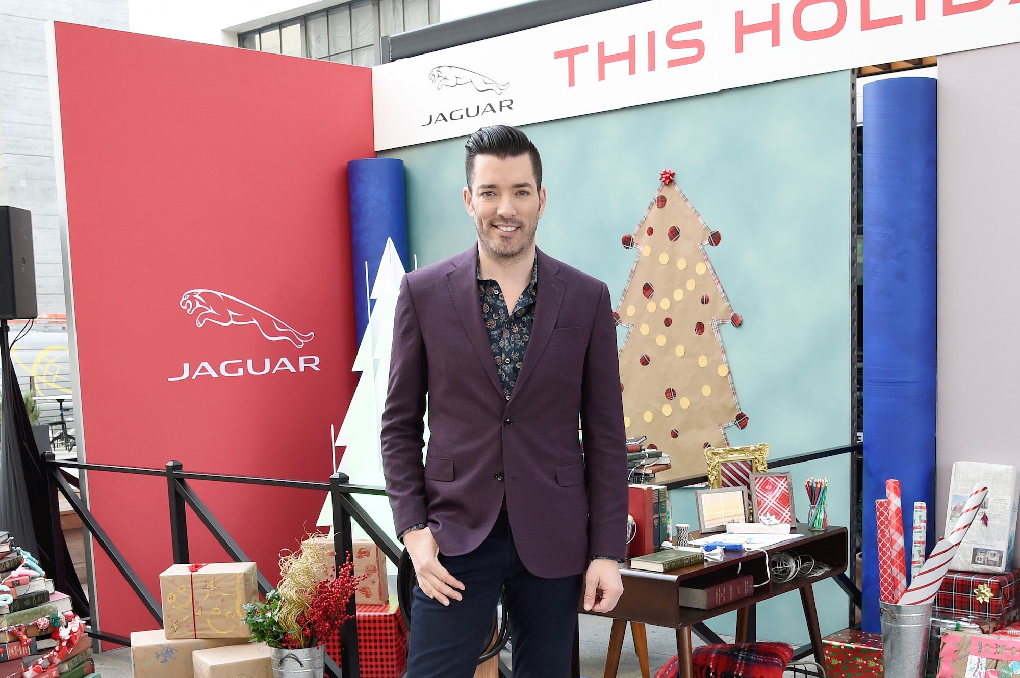 Jonathan Scott smiling in front of a holiday display