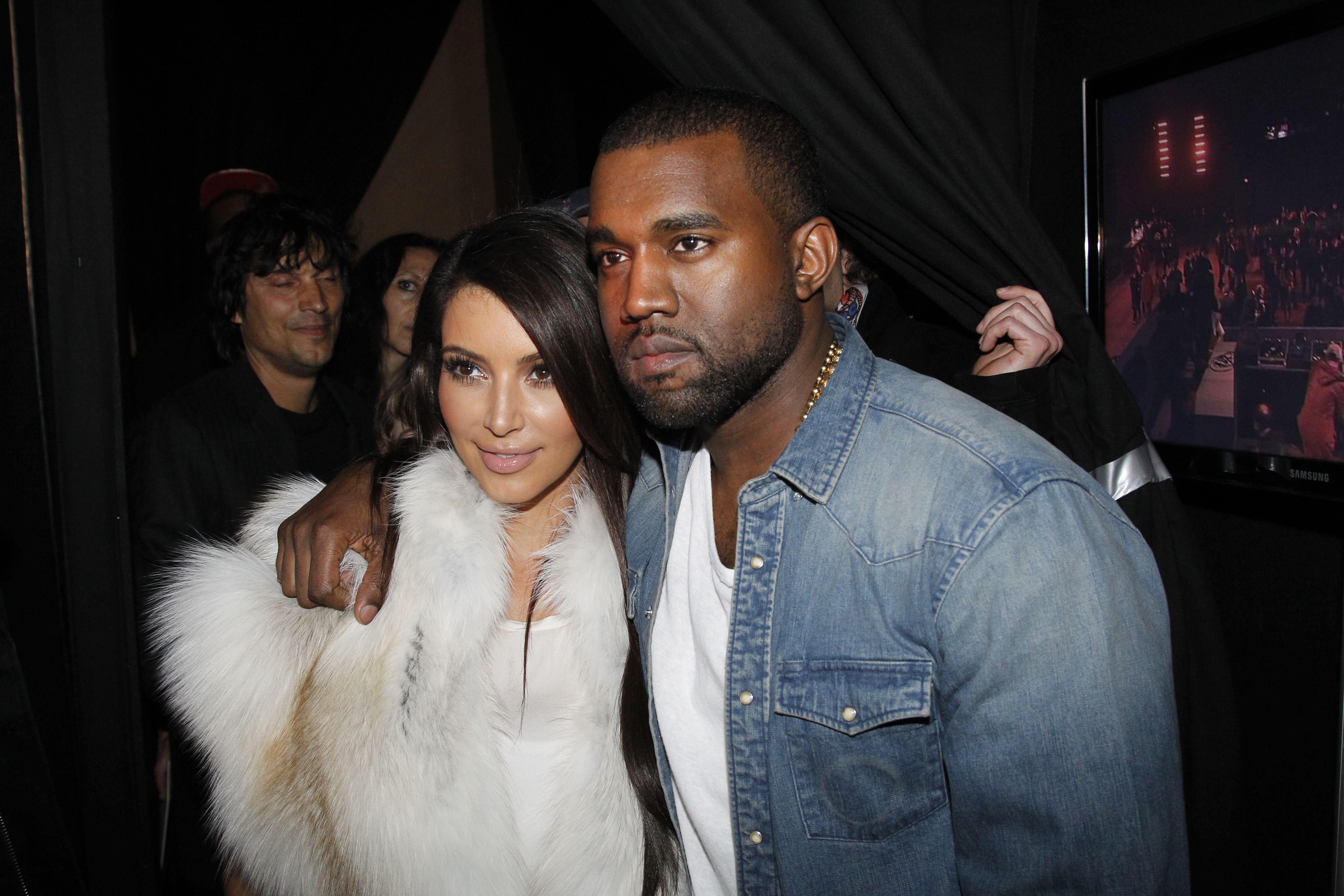 Kim Kardashian and Kanye West attend the Kanye West  Ready-To-Wear Fall/Winter 2012 show