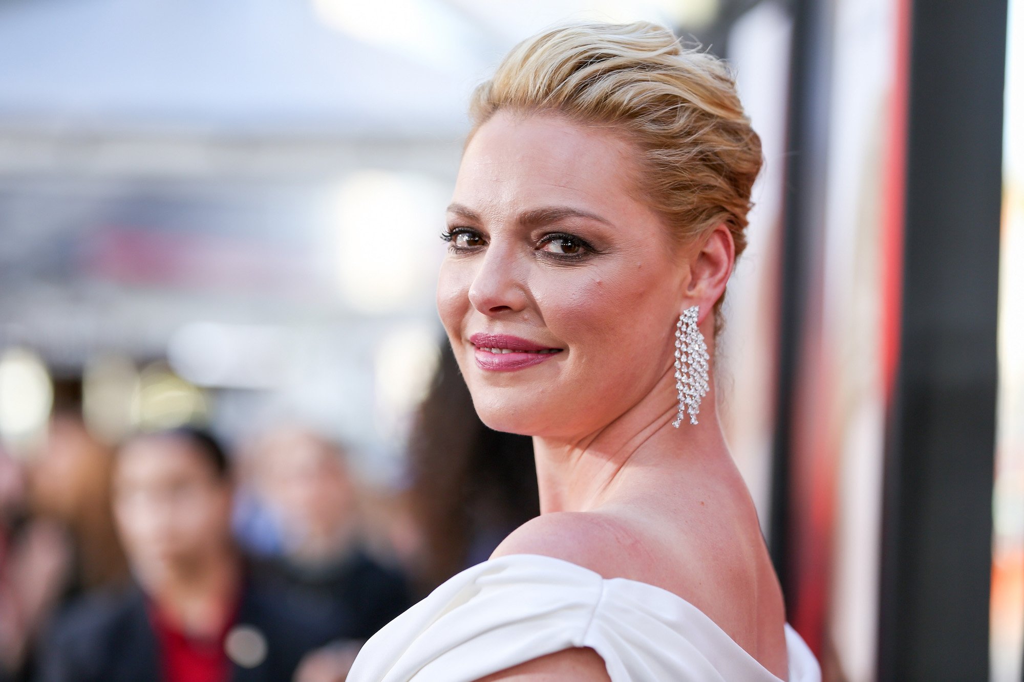 Katherine Heigl smiling, looking back at the camera