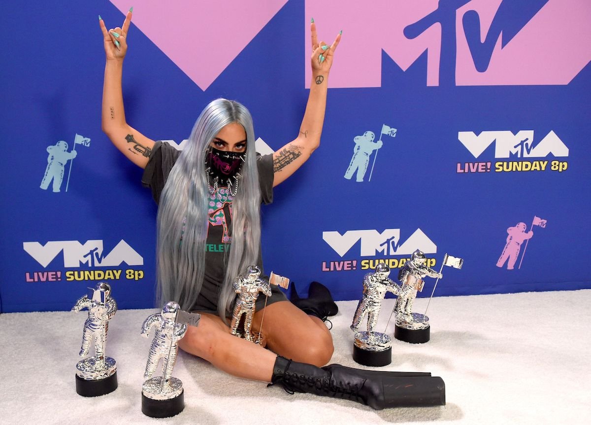 Lady Gaga poses with her awards