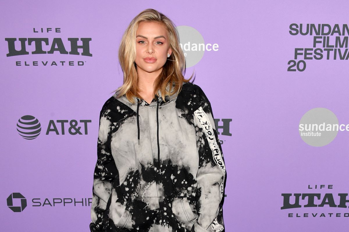 Lala Kent in a hoodie in front of purple background