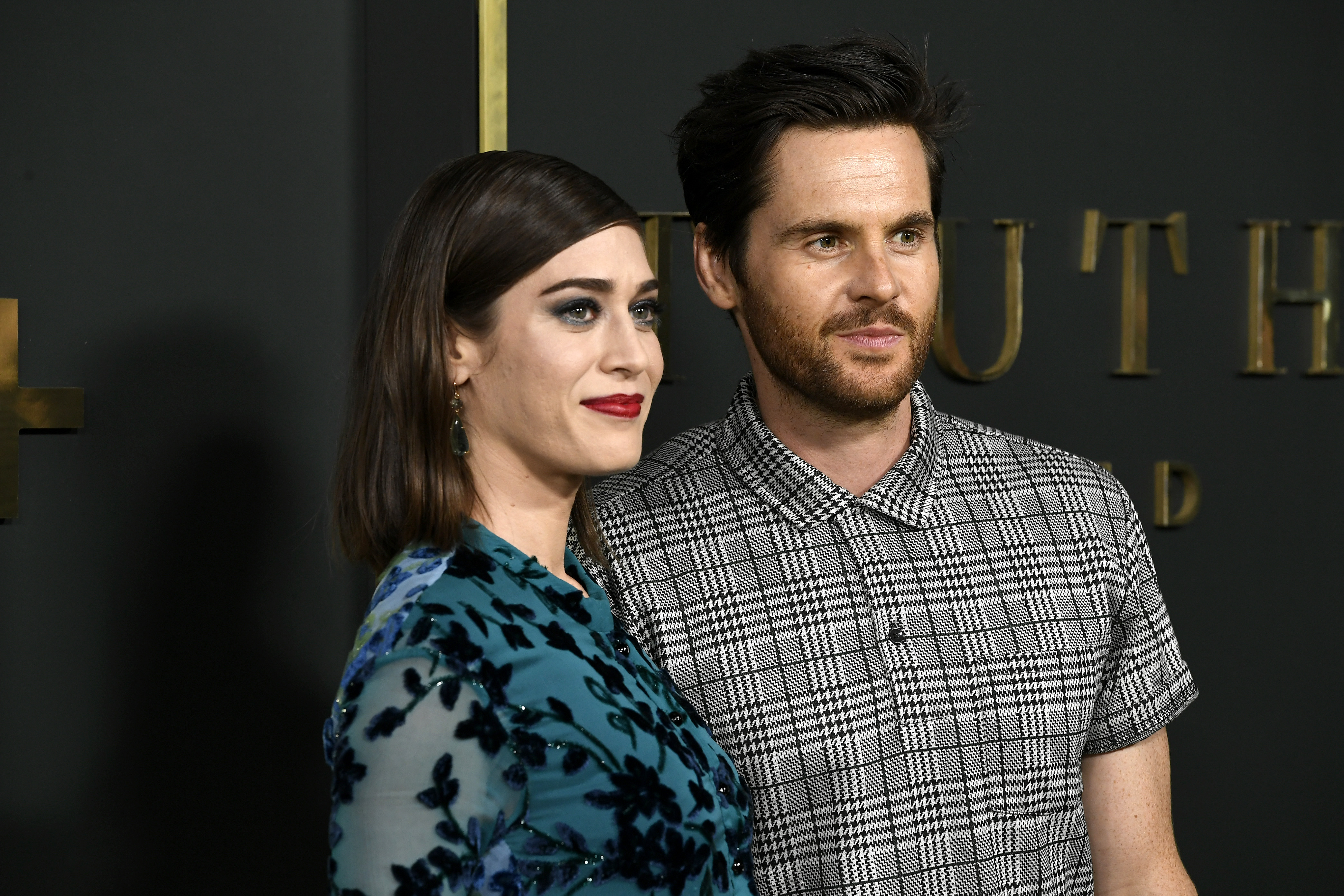 Lizzy Caplan and Tom Riley attend the Premiere Of Apple TV+'s 'Truth Be Told' 