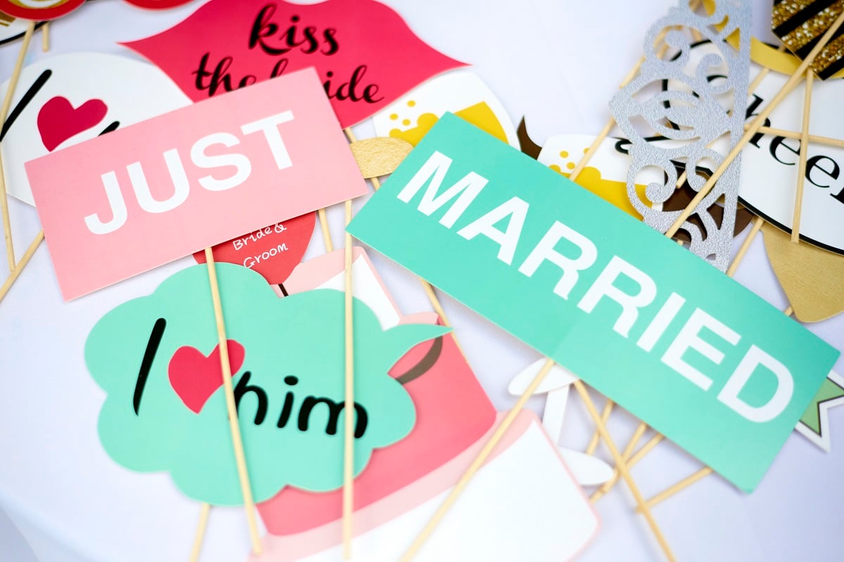 Lifetime 'Married at First Sight' event signs that say 'Just Married' and 'Kiss the Bride'