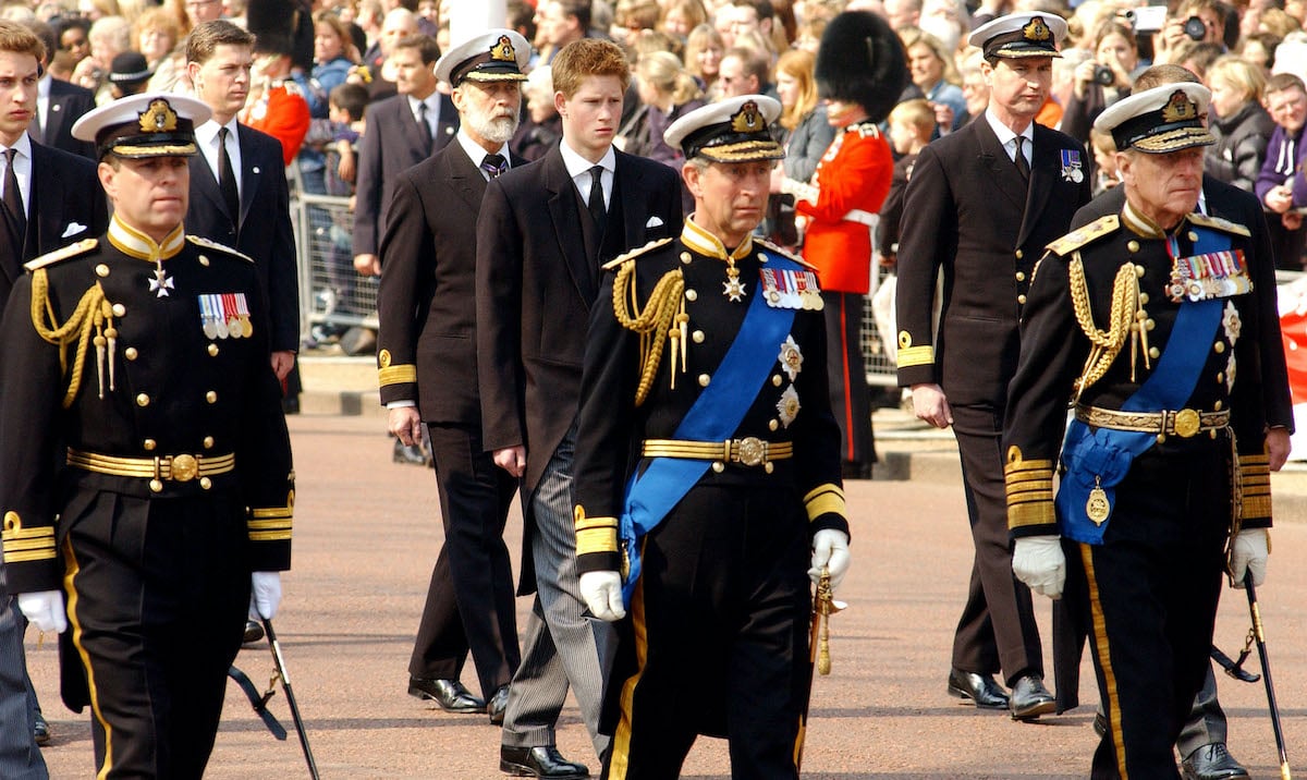 Britain's Prince Charles (R), Prince Phillip (C) and Prince Andrew (L) lead Prince Harry and other Royals as they walk behind the coffin bearing the Queen Mother April 5, 2002 as her ceremonial procession makes its way down the Mall in London. The Queen Mother's body will lie in state in Westminster Hall before her funeral in four days