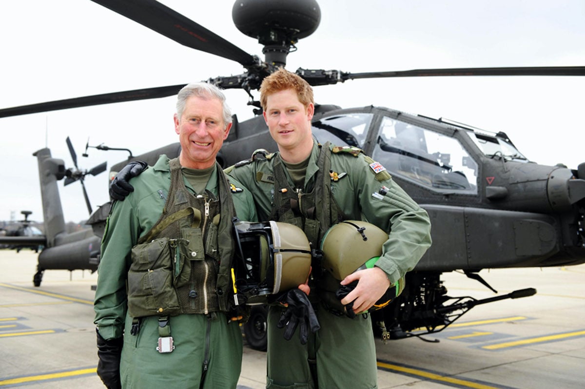 Prince Harry and his father, the Prince Charles, Prince of Wales, stand in front of an Apache Helicopter after Prince Charles was invited by the Army Aviation Centre in his role as Colonel-in-Chief of the Army Air Corps (AAC) in order to fly an Apache and to meet students on the Apache Conversion Course on March 21, 2011 in Middle Wallop, England. The announcement by St James's Palace comes a few days after the royal, a trainee Apache helicopter pilot, passed the half-decade milestone