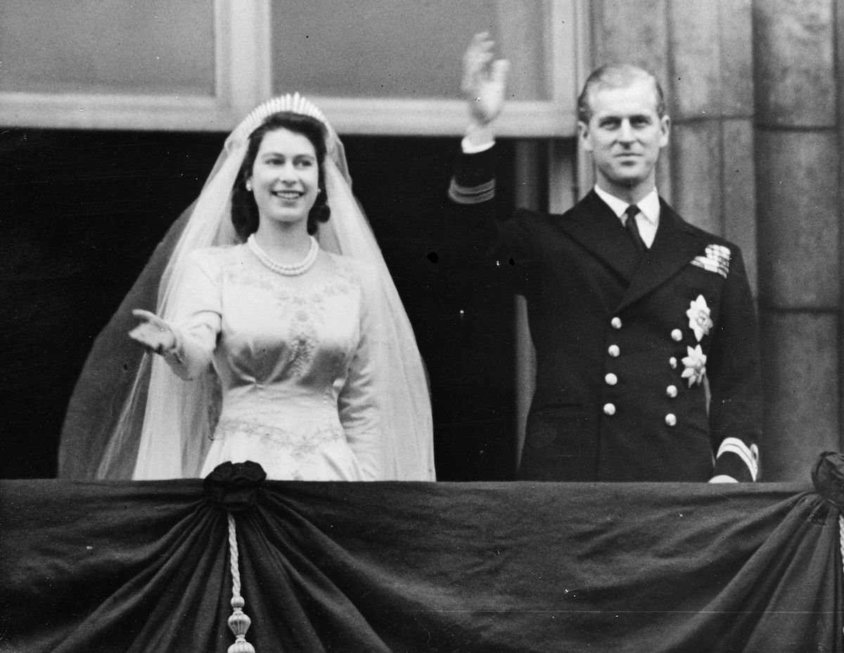20th November 1947:  Princess Elizabeth and The Prince Philip, Duke of Edinburgh waving to a crowd from  the balcony of Buckingham Palace, London shortly after their wedding at Westminster Abbey