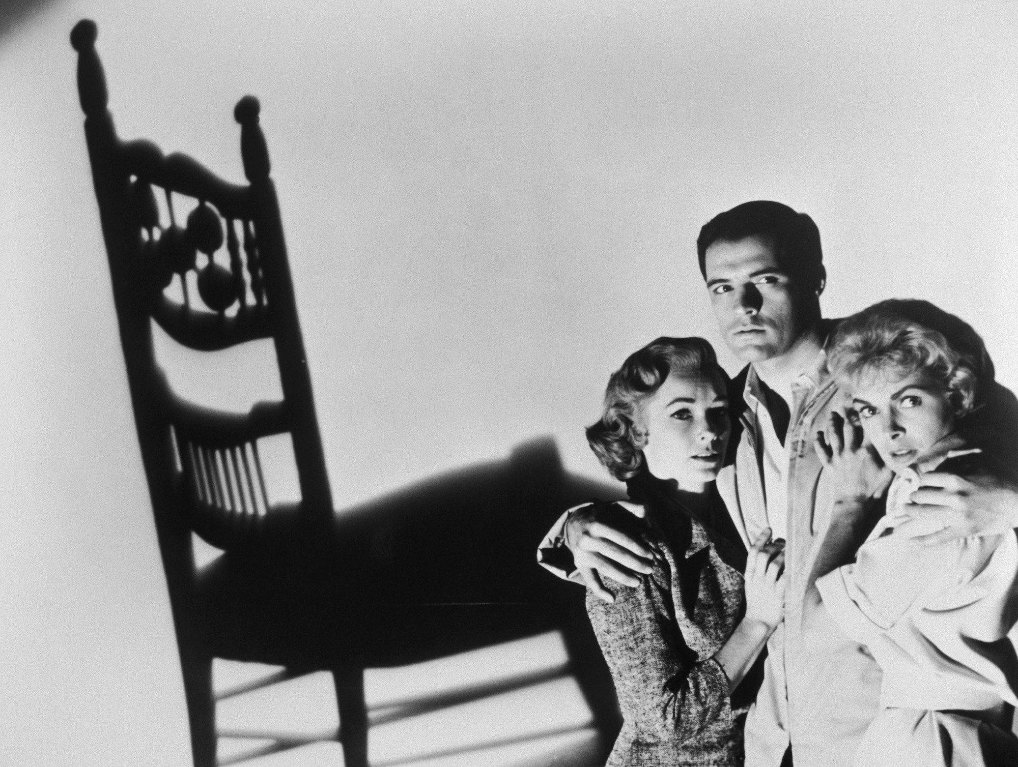(L-R) Vera Miles, John Gavin, and Janet Leigh in the corner, in front of a wall with the shadow of a chair