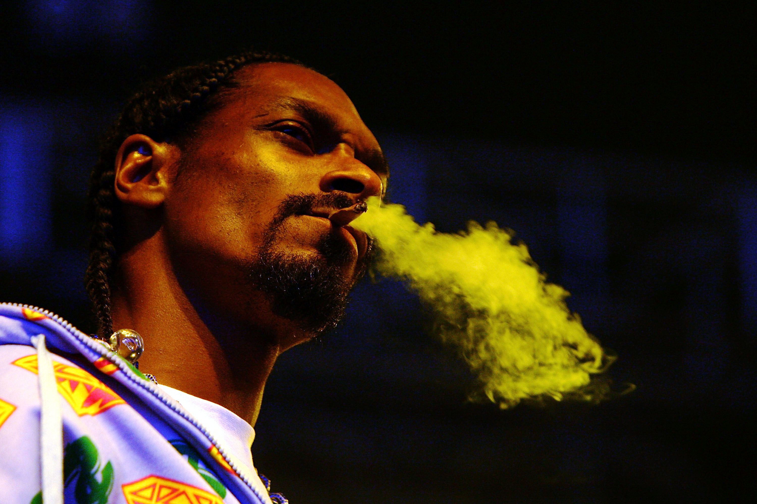 Rapper Snoop Dogg smokes while performing at the Melbourne stop of the Good Vibrations Festival 2007 in Melbourne, Australia | Kristian Dowling/Getty Images