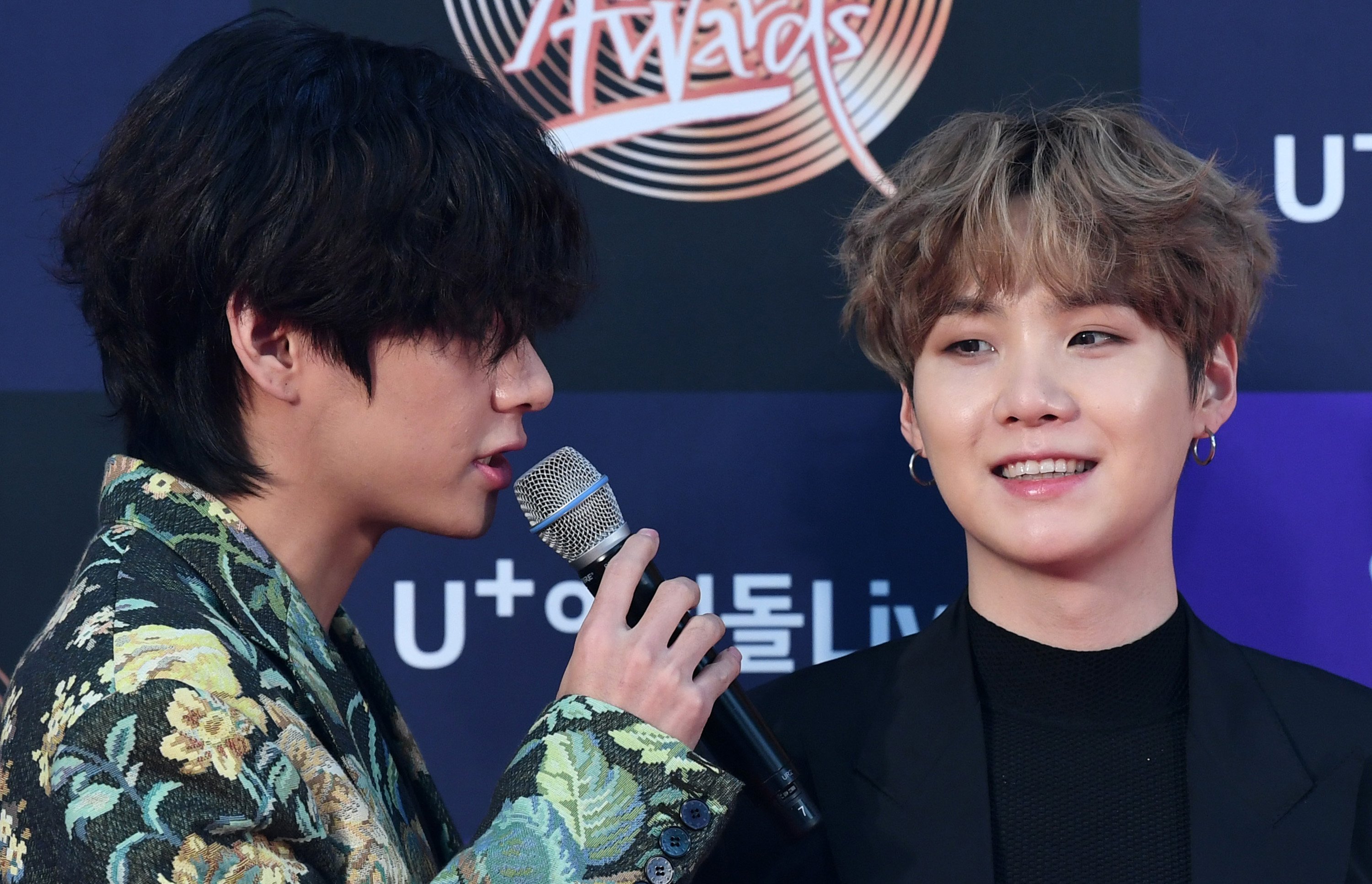 V and Suga of BTS arrive at the photo call for the 34th Golden Disc Awards  