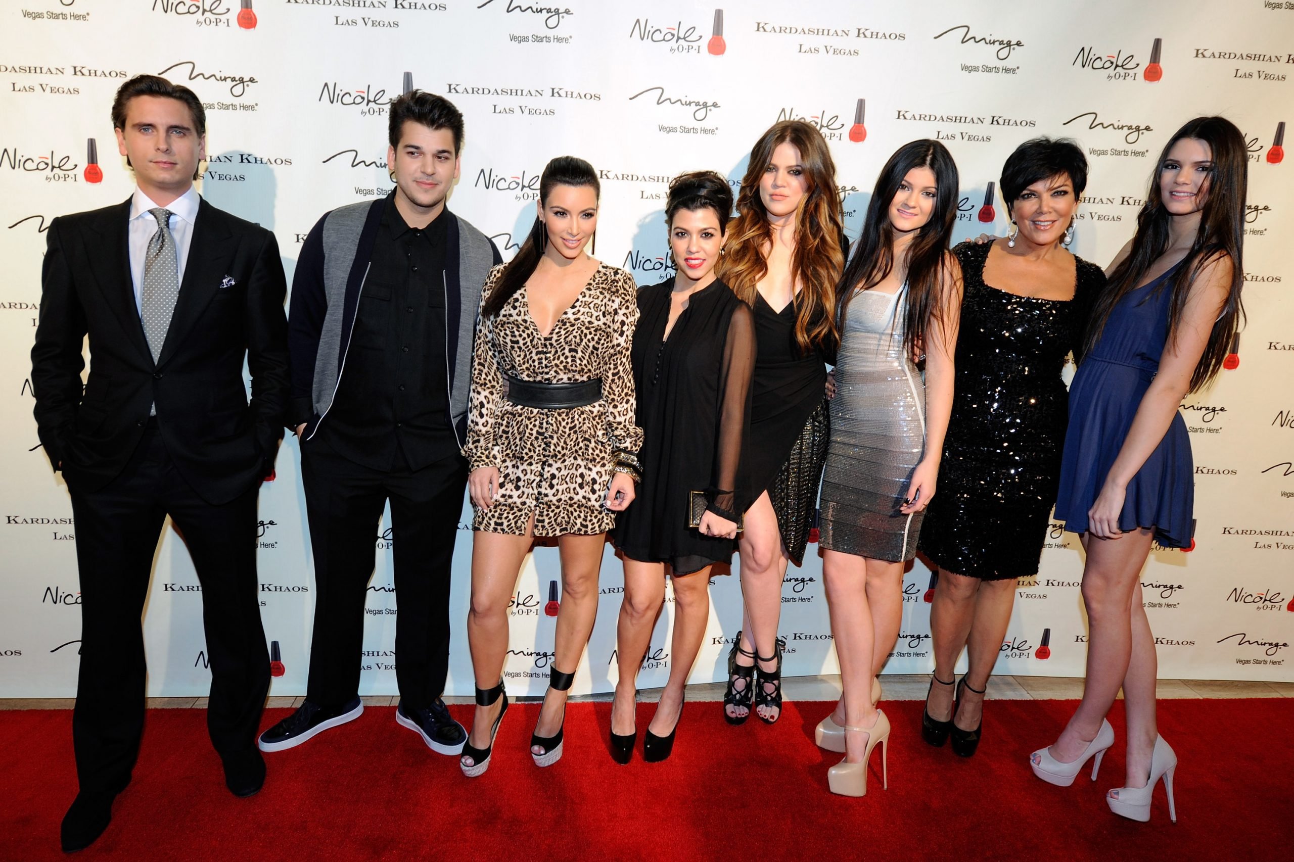 Scott Disick, Robert Kardashian Jr., Kim Kardashian, Kourtney Kardashian, Khloe Kardashian, Kylie Jenner, Kris Jenner and Kendall Jenner arrive at the grand opening of the Kardashian Khaos store at The Mirage Hotel & Casino December 15, 2011 in Las Vegas, Nevada