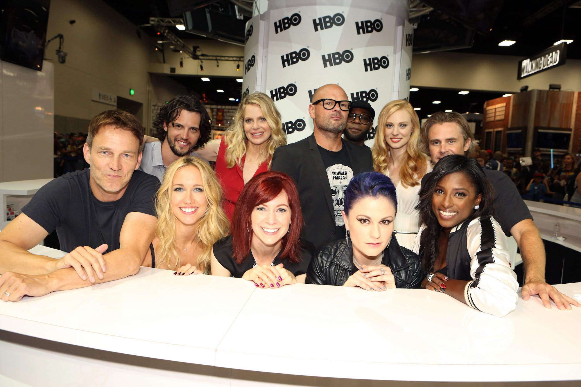 (L-R) Stephen Moyer, Anna Camp, Carrie Preston, Anna Paquin and Rutina Wesley; back row, from L-R: Nathan Parsons, Kristin Bauer van Straten, Chris Bauer, Nelsan Ellis, Deborah Ann Woll and Sam Trammell smiling