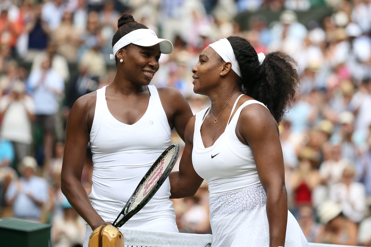 Venus Williams embraces sister Serena after defeat in the 4th round on day 7 of the Wimbledon Lawn Tennis Championships | Marc Atkins/Mark Leech/Getty Images