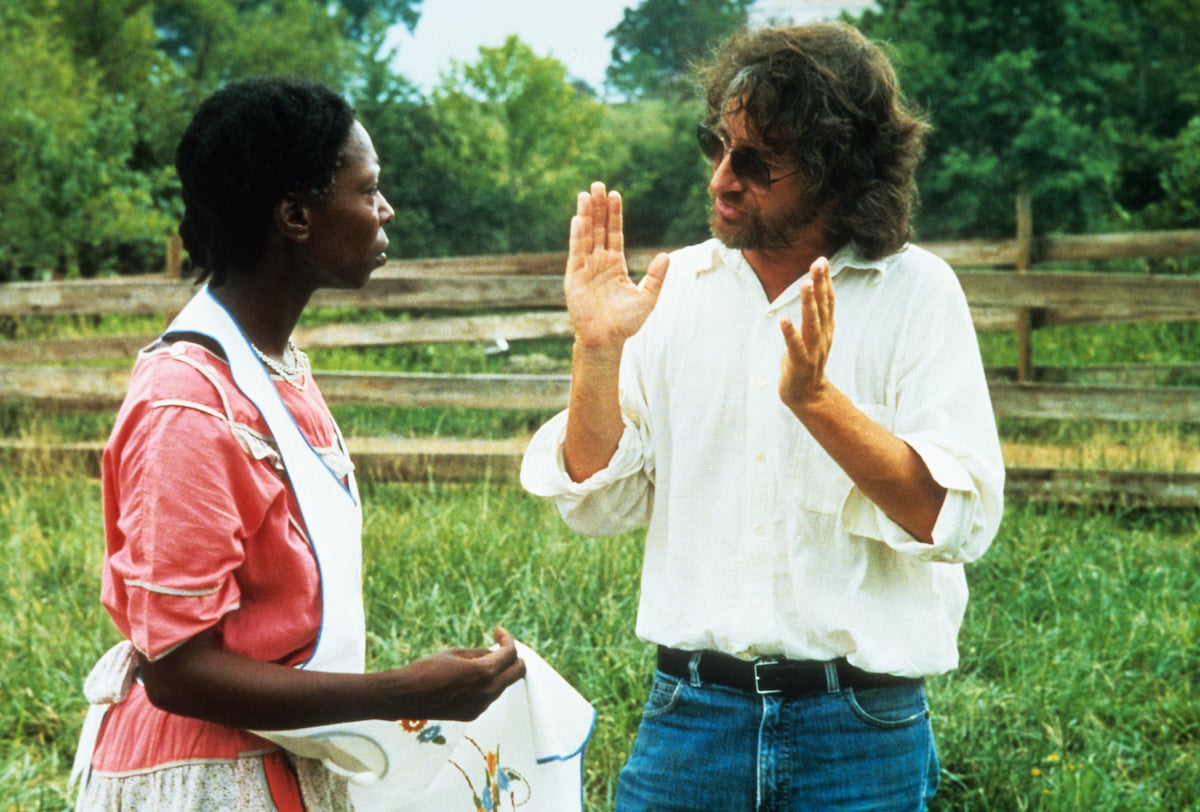 Whoopi Goldberg has conversation with Steven Spielberg off-camera from the film The Color Purple, 1985 | Warner Brothers/Getty Images