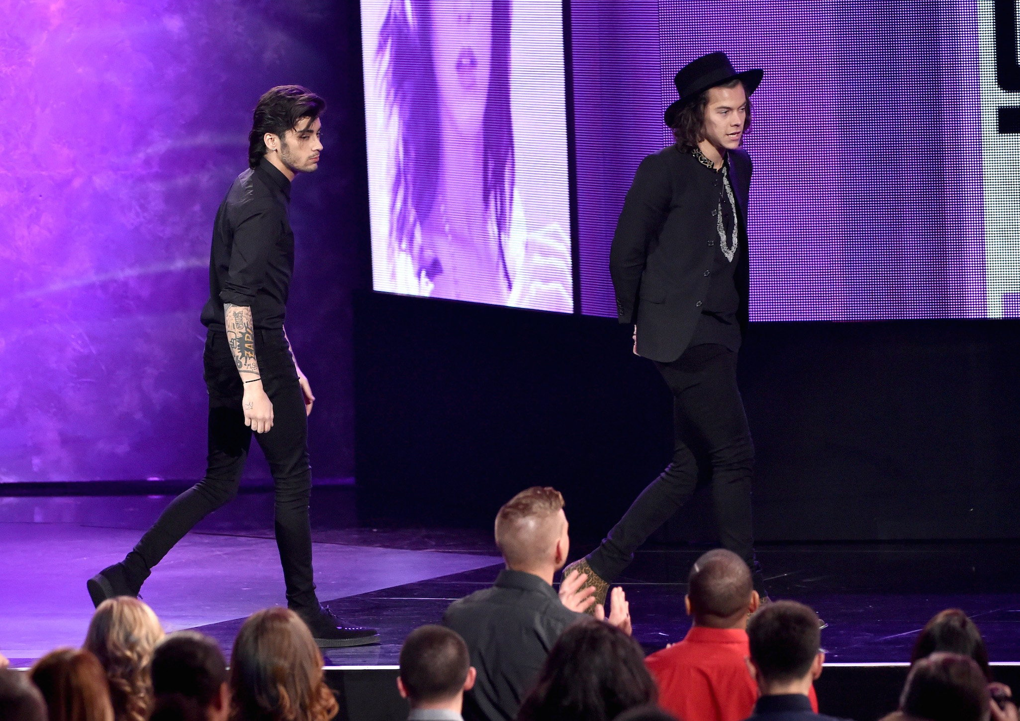 Zayn Malik (L) and Harry Styles of One Direction onstage at the 2014 American Music Awards 