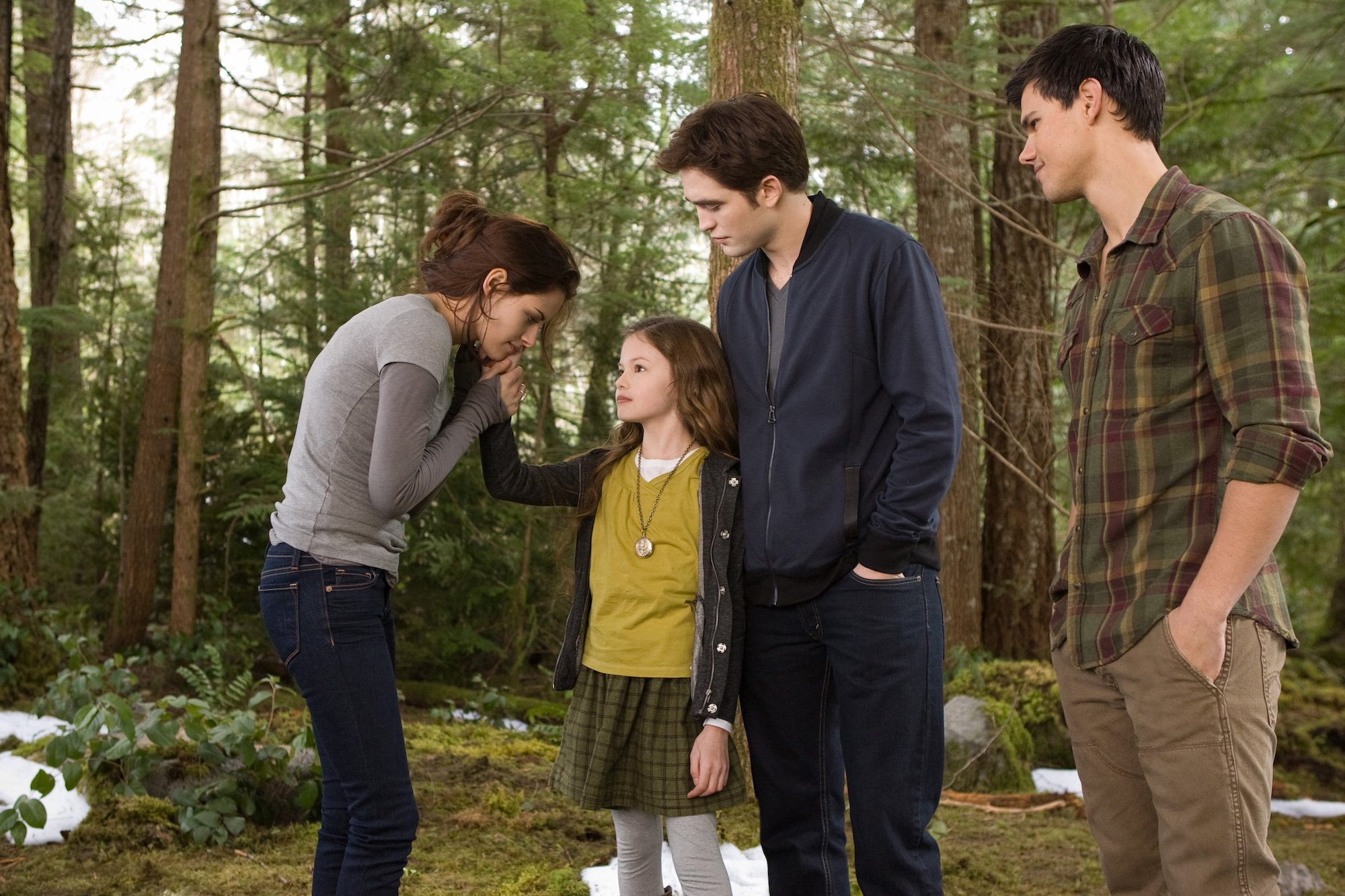 Kristen Stewart, Mackenzie Foy, Robert Pattinson, and Taylor Lautner at the end of 'The Twilight Saga: Breaking Dawn Part 2.' 