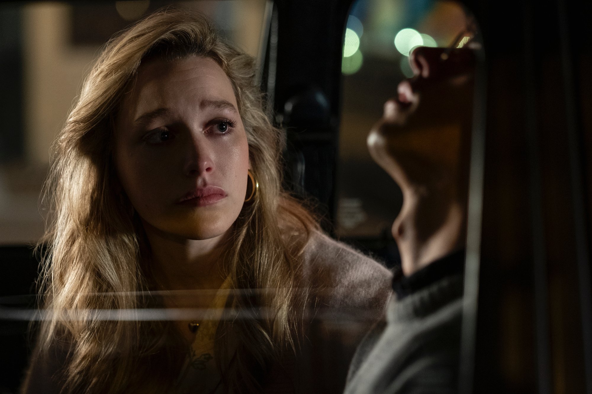 Victoria Pedretti as Dani and Roby Attal as Eddie in 'THE HAUNTING OF BLY MANOR' as she comes out to him in his car.