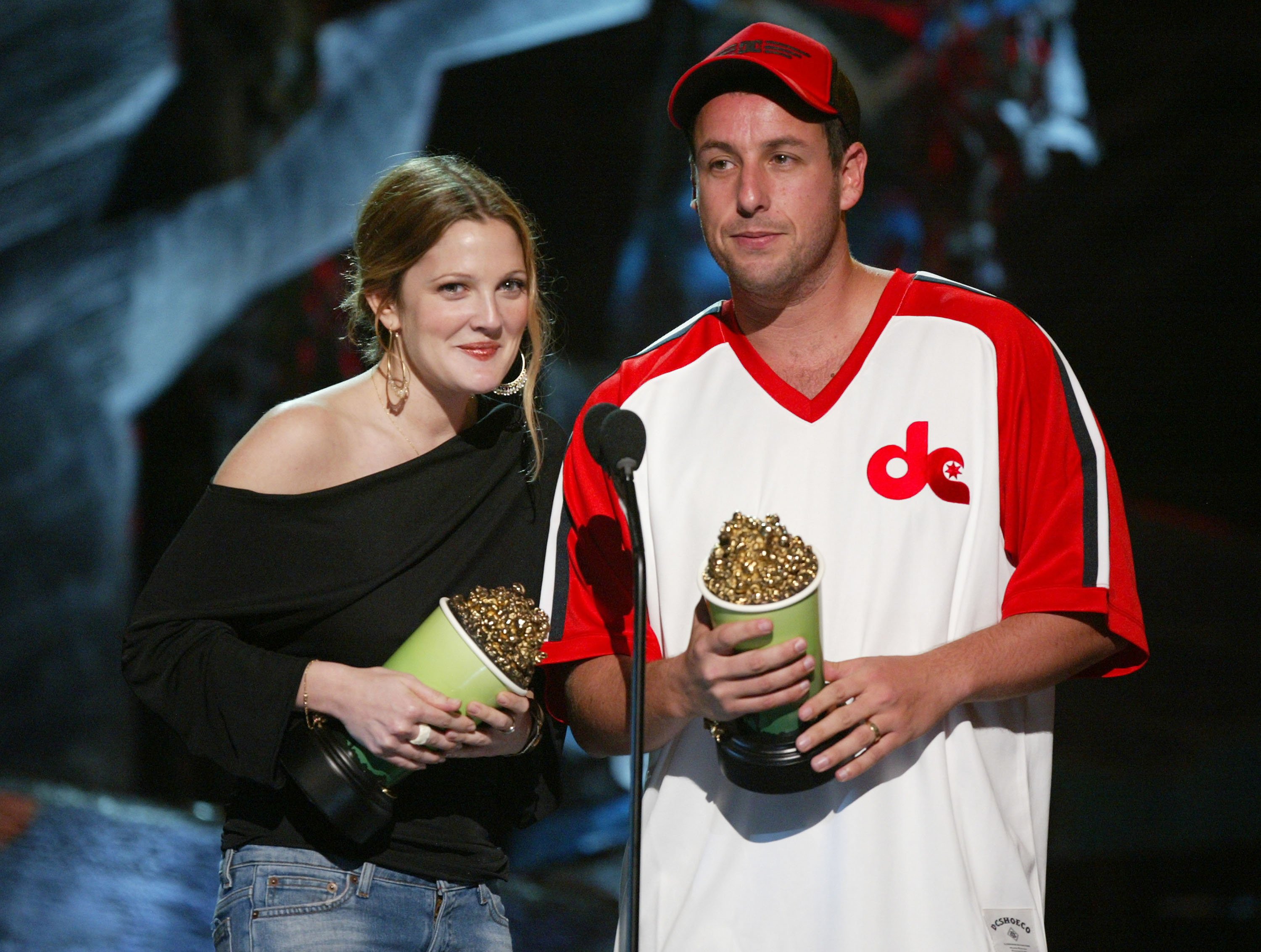 Drew Barrymore and Adam Sandler on stage at the 2004 MTV Movie Awards on June 5, 2004