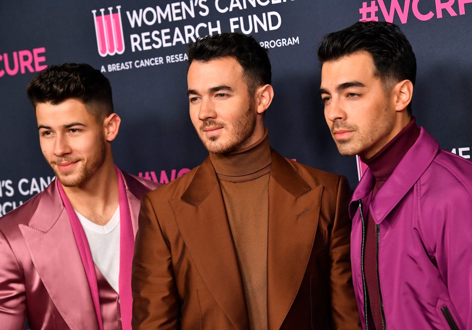 Nick Jonas, Kevin Jonas, and Joe Jonas of Jonas Brothers attend The Women's Cancer Research Fund's An Unforgettable Evening 2020 