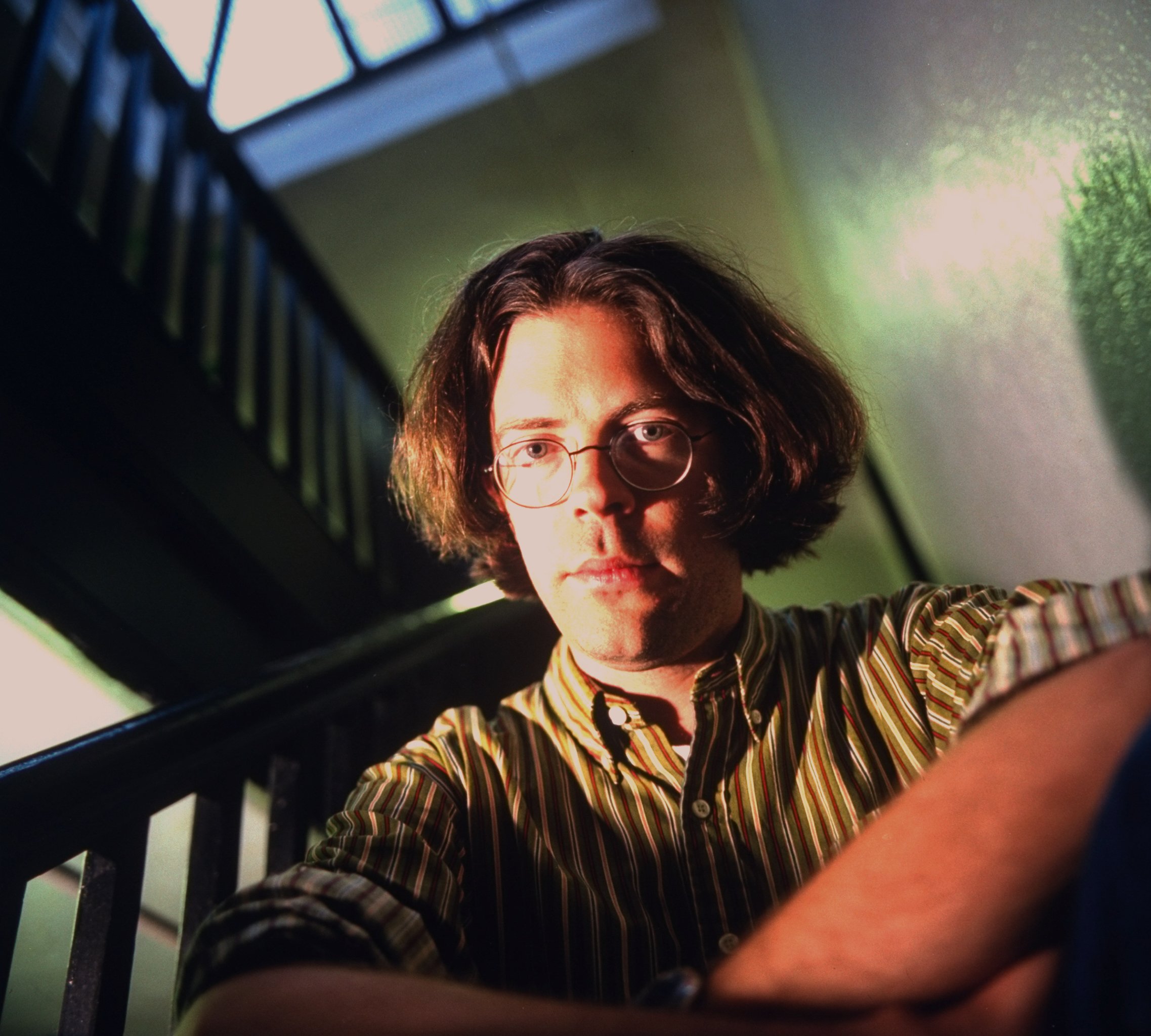 Jonathan Franzen sitting on stairs