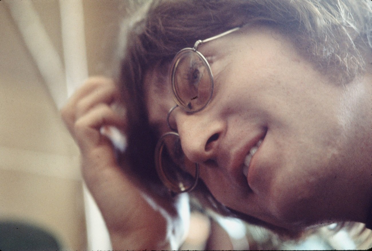 John Lennon smiles